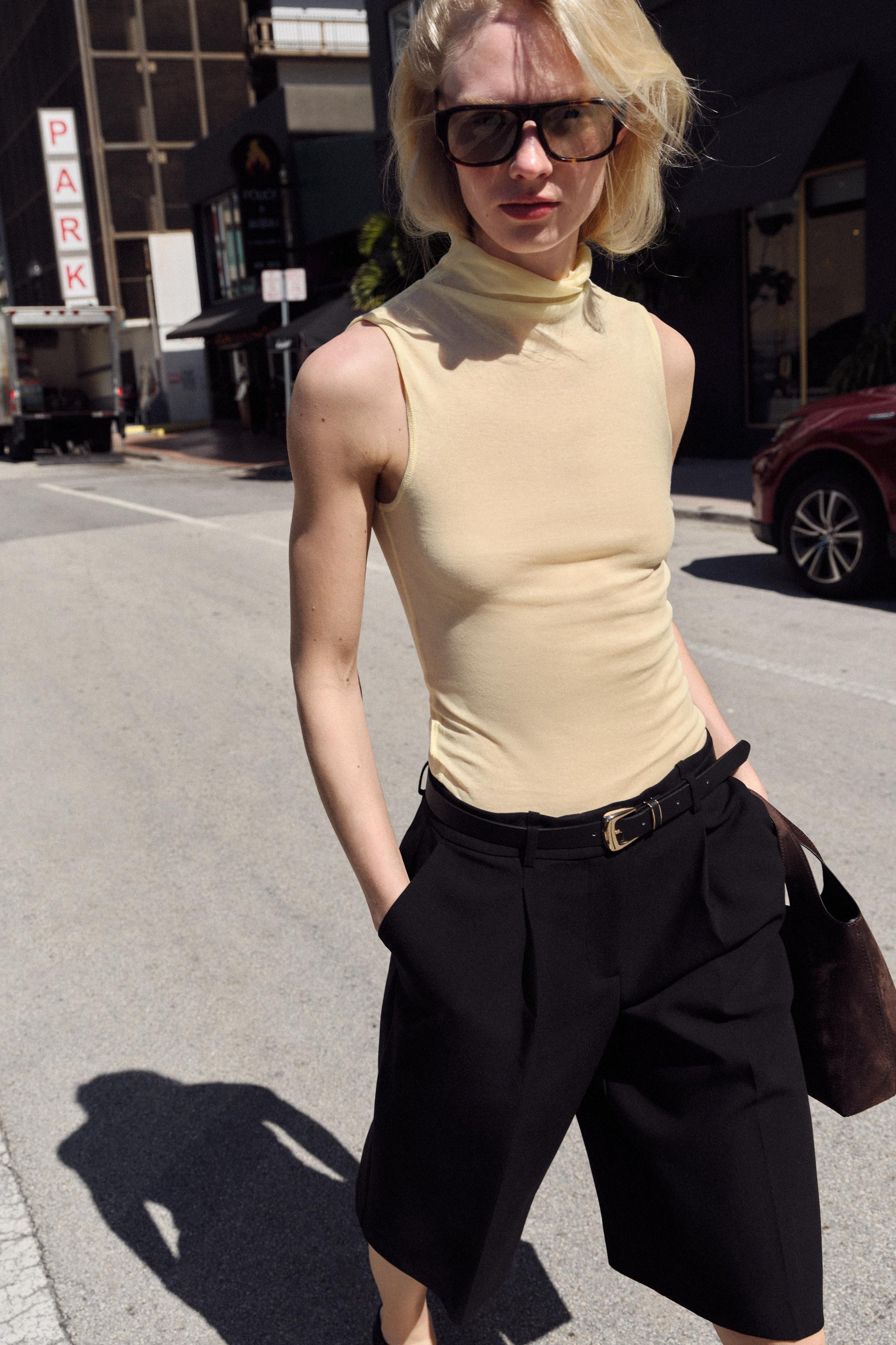 High-waisted shorts with front pleats and a belt. Front pockets and false back flap pocket. Front... | Zara US