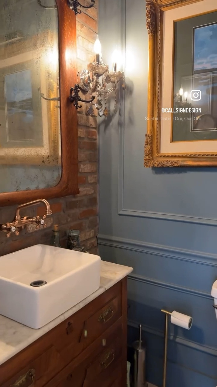 Everyone’s favorite tiny bathroom is getting a little spring refresh.  A crisp white, ruffled shower curtain really makes the brick and colors pop in here!