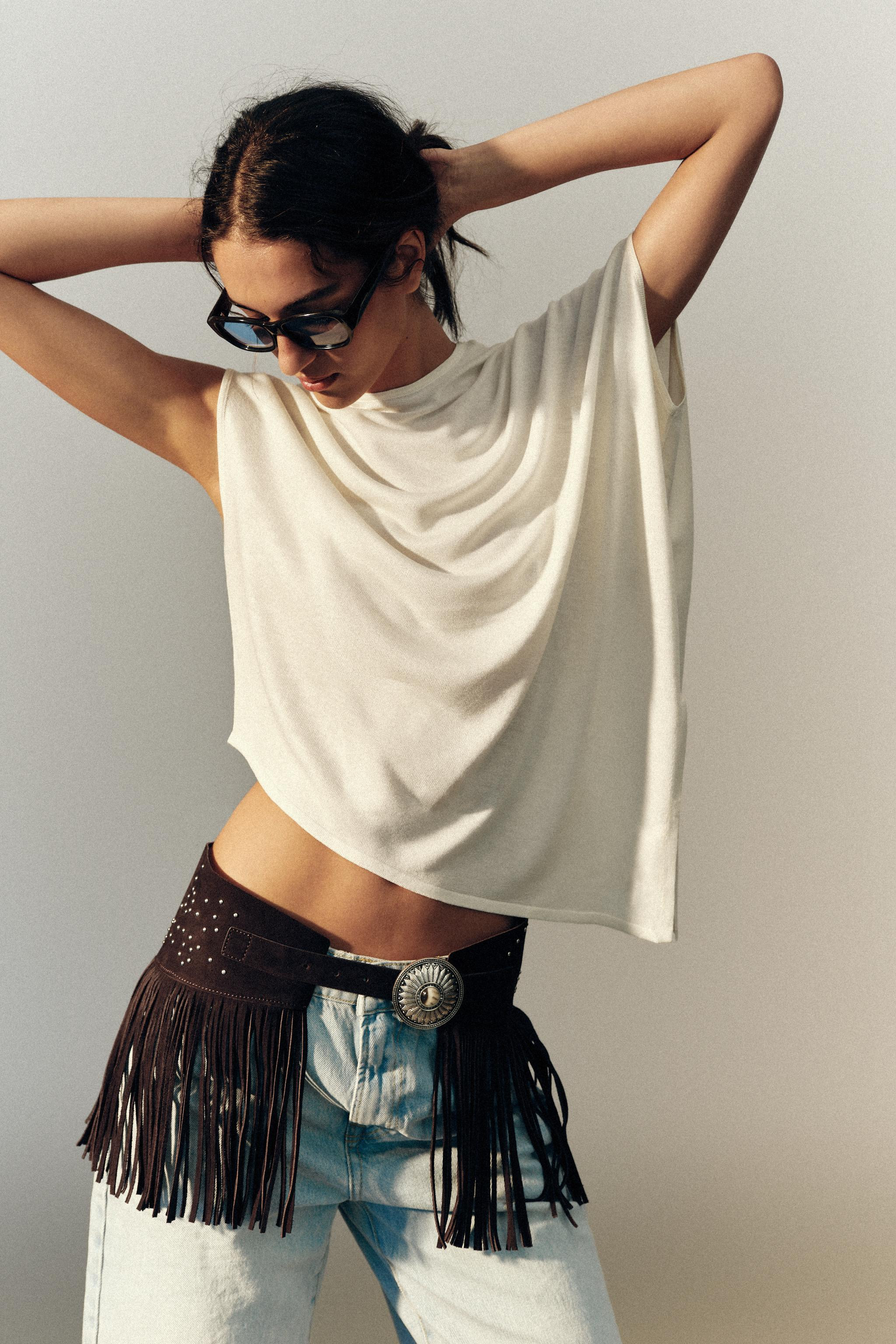 Skirt-style belt crafted in 100% leather. Featuring contrasting stud appliqu\u00e9 details, a fri... | Zara US