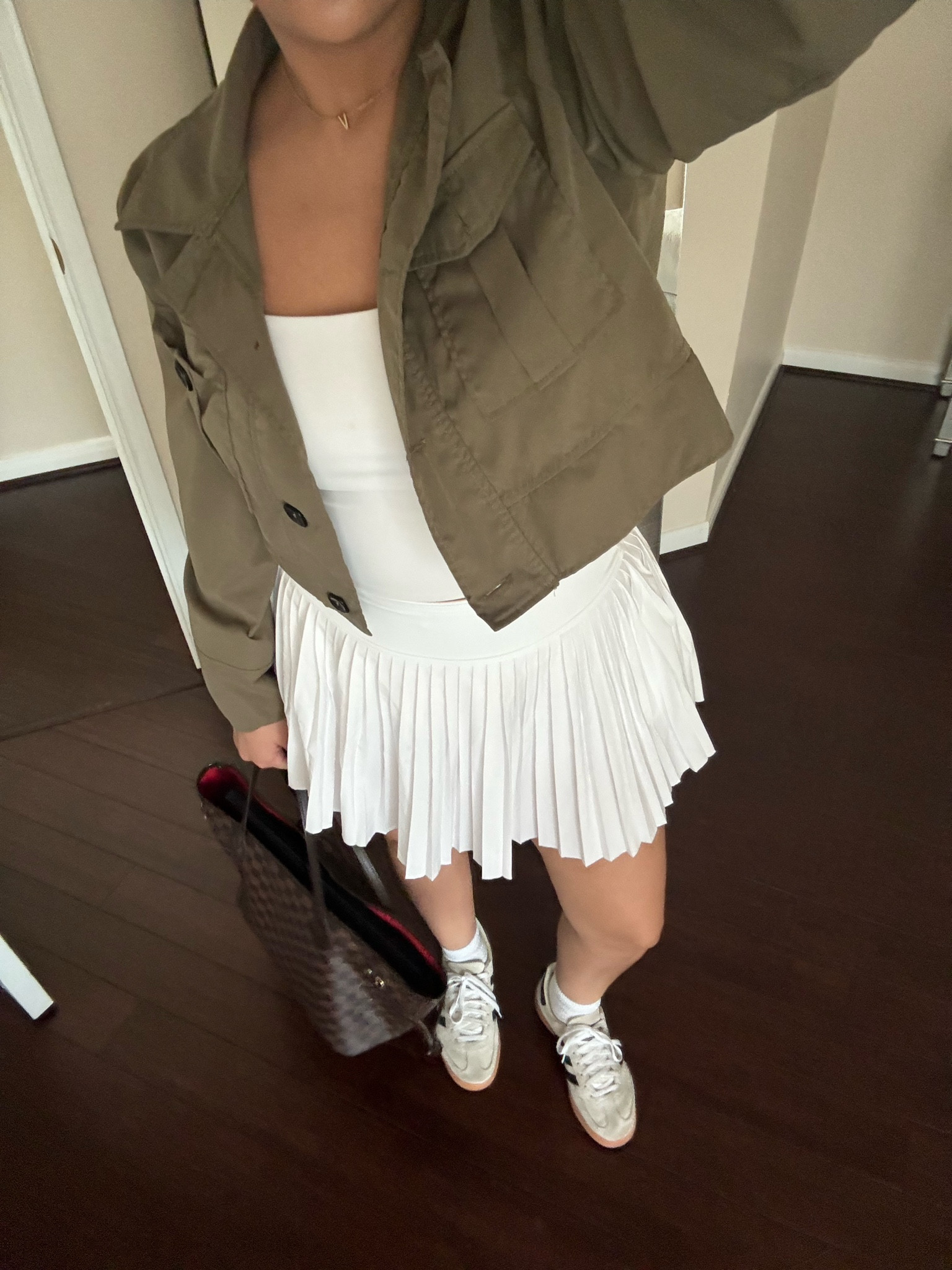 Casual work from coffee shop outfit 
White tank: small 
White tennis skirt: small 
Cropped jacket: small 
Adidas handball spezial: 4.5 men 
White socks  
Lv neverfull tote bag 

#LTKSaleAlert #LTKFindsUnder100 #LTKStyleTip