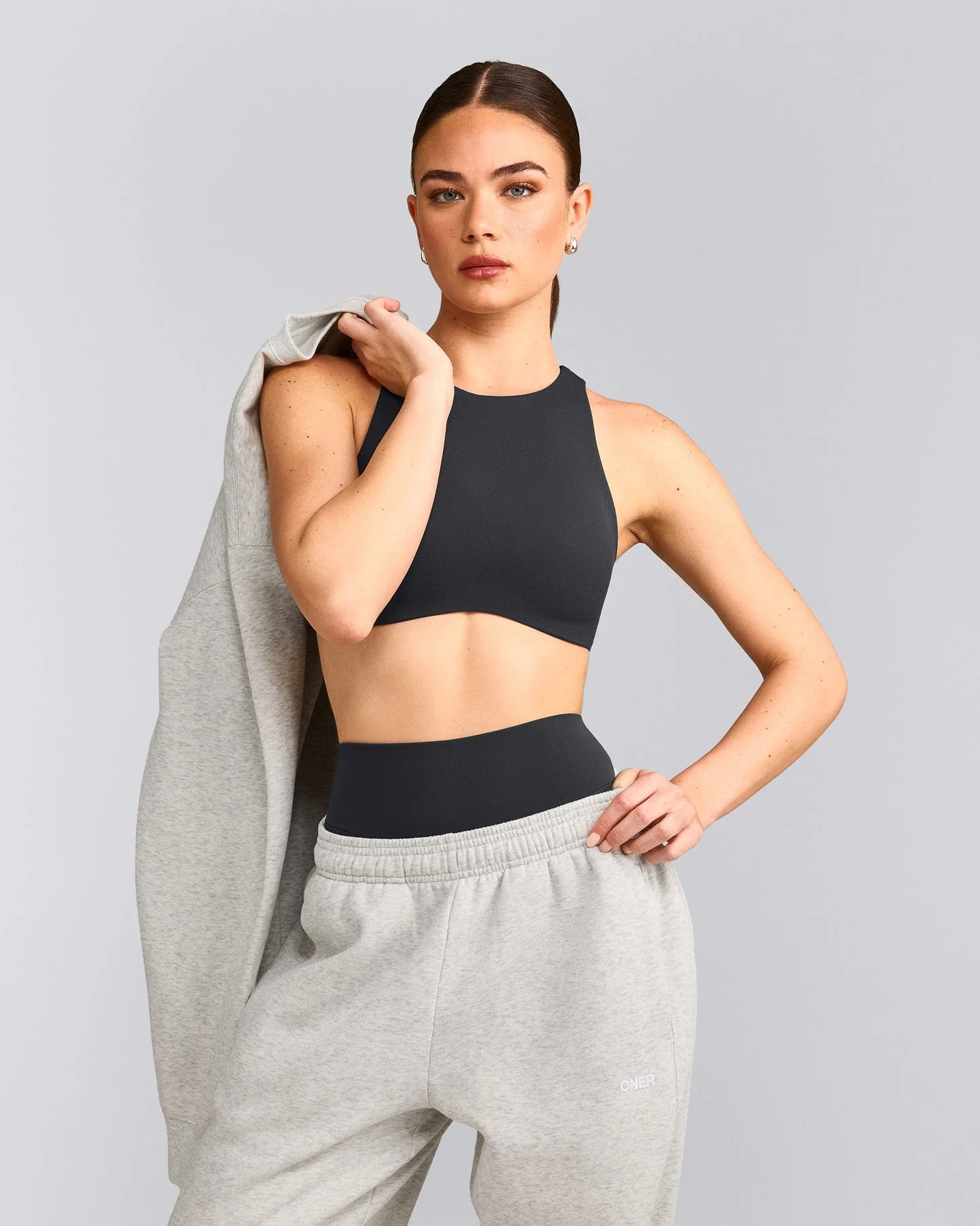 SoftMotion\u2122 High Neck Sports Bra with Gray Logo
Coal | Oner Active (UK / US)
