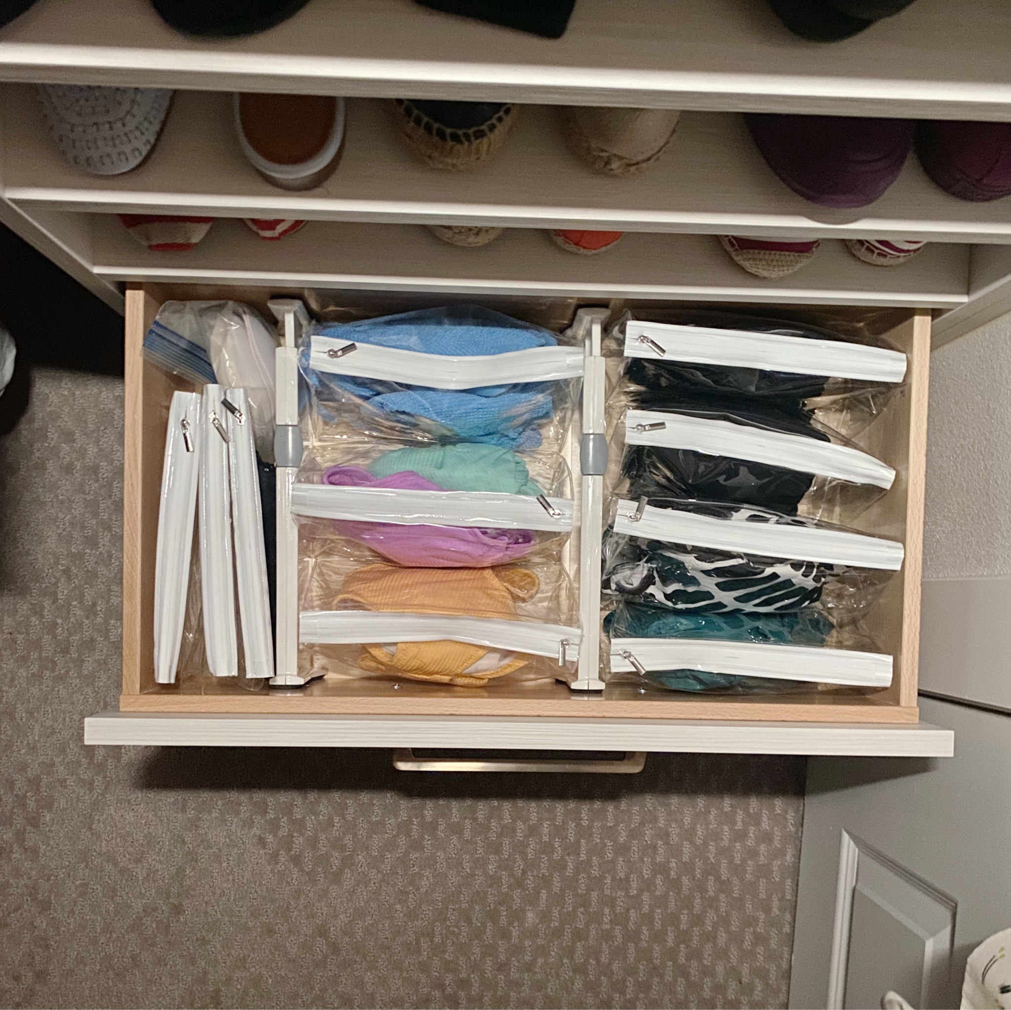 Two things I really like: #1 Adjustable drawer dividers and #2 Storing 👙 in clear plastic makeup bags or ziplock bags.

The adjustable drawer dividers offer flexibility, allowing you to easily alter how things are stored in the drawer.

As for the bagged bathing suits—imagine opening your swimsuit storage and effortlessly finding the 👙 you're looking for! Then, toss it into your suitcase or bag and remove it at your destination with absolutely no stress.

#LTKtravel #LTKfindsunder50 #LTKhome