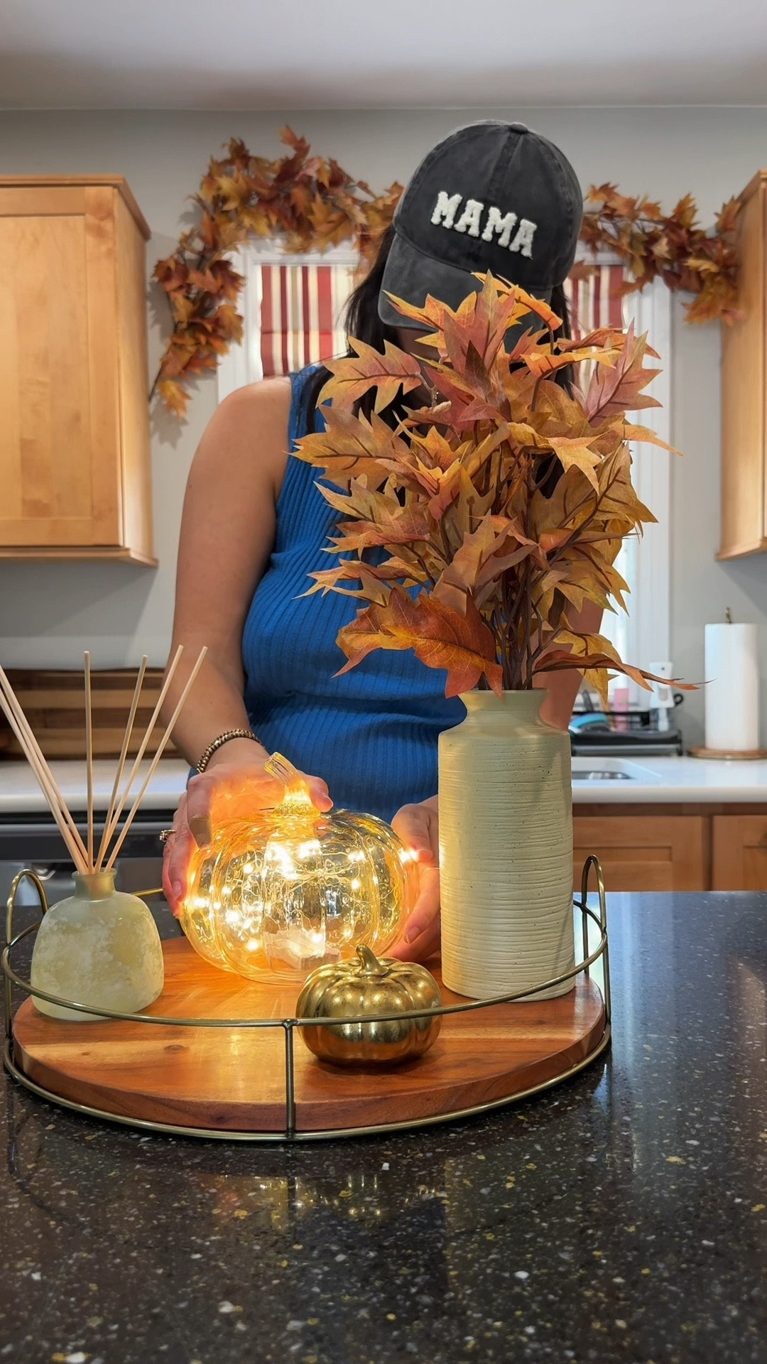 
this fall kitchen decor is making my heart happy!! ♥️

fall decor in my kitchen on the island! LED lit glass pumpkin, fall stems in a vase, diffuser, gold pumpkins, black metal holiday houses, autumn leaves garland and LED candles! 

#LTKHome #LTKSeasonal #LTKFindsUnder50