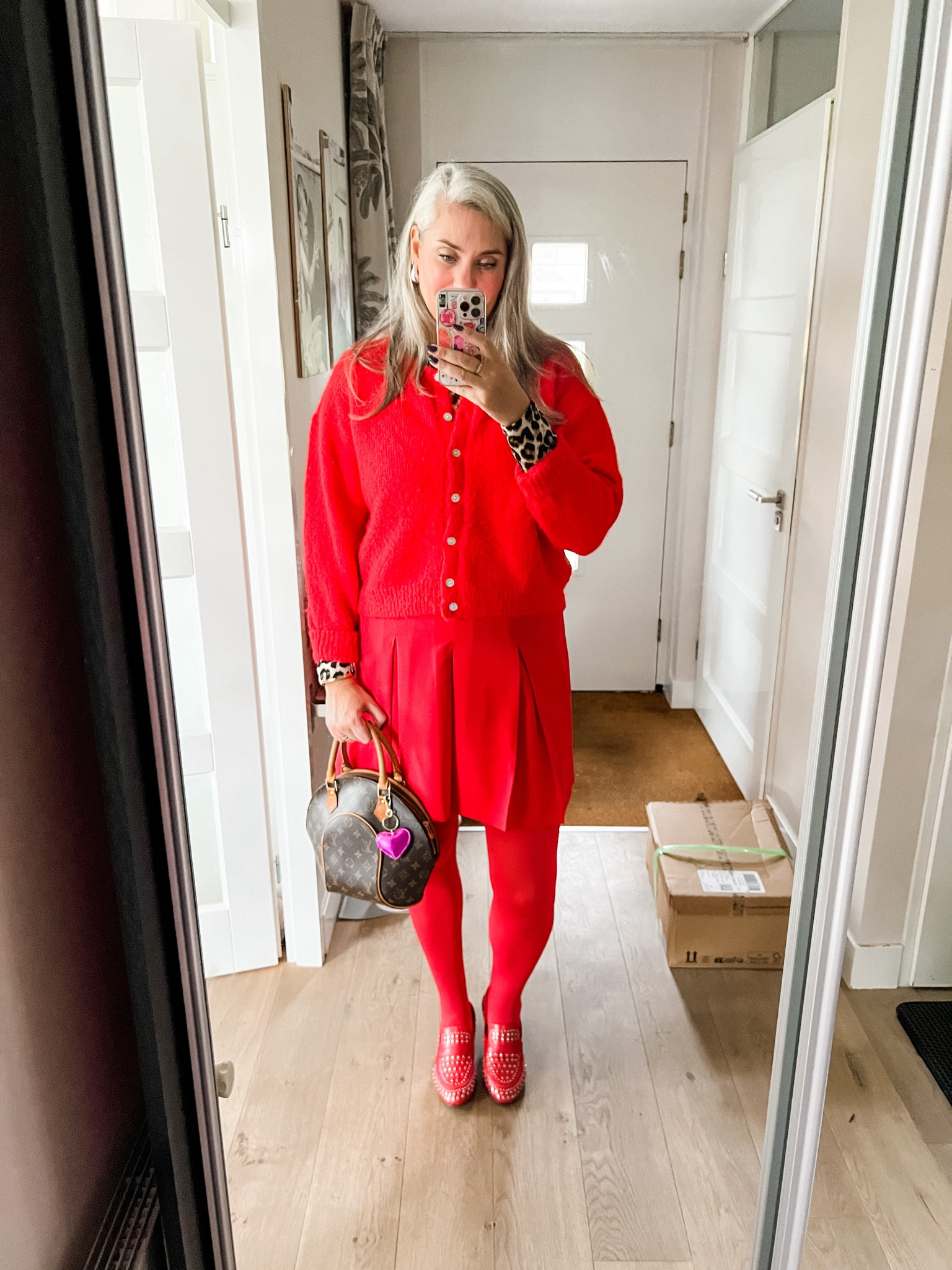 Ootd - Friday. Leopard longsleeve top (old), red cardigan (Je m’appelle), red pleated skirt (Bonprix), red tights (Snag) and red studded loafers (old), vintage Louis Vuitton Ellipse bag. 

 

#LTKeurope #LTKnederlands #LTKCyberWeek