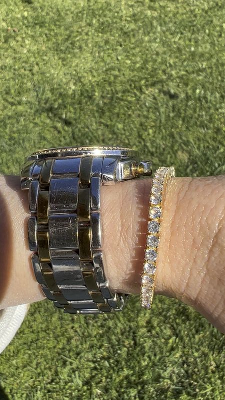 Would you believe me if I told you this tennis bracelet is only $17?!  I LOVE it! I’m going to order the white gold as well.  💫

***watch is SUPER old and doesn’t work anymore.  Currently looking for a new one. 

#LTKfindsunder50 #LTKGiftGuide #LTKVideo