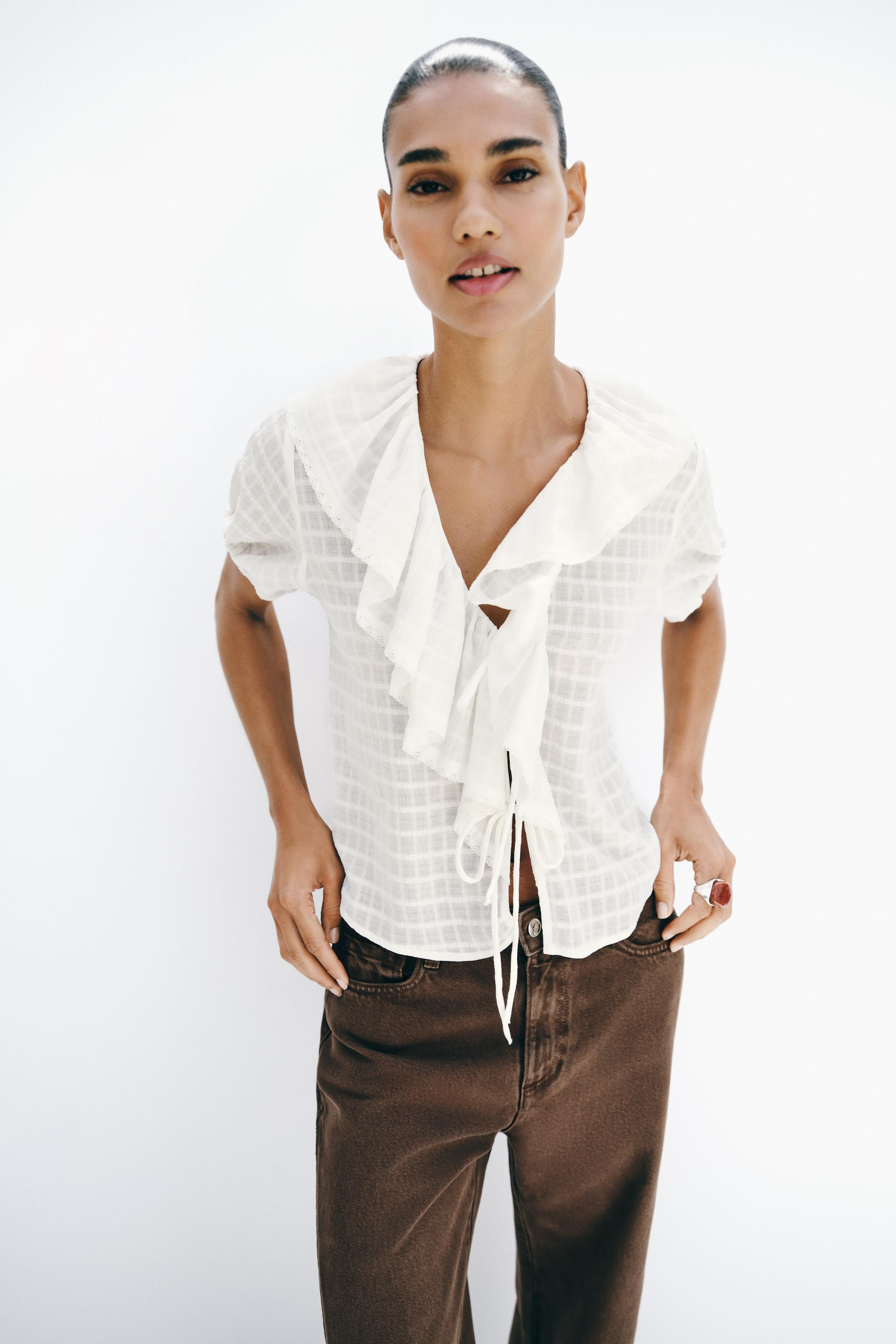 DescriptionContentsMeasurementsBlouse made from 100% cotton yarn. V-neckline with ruffles and lac... | Zara US