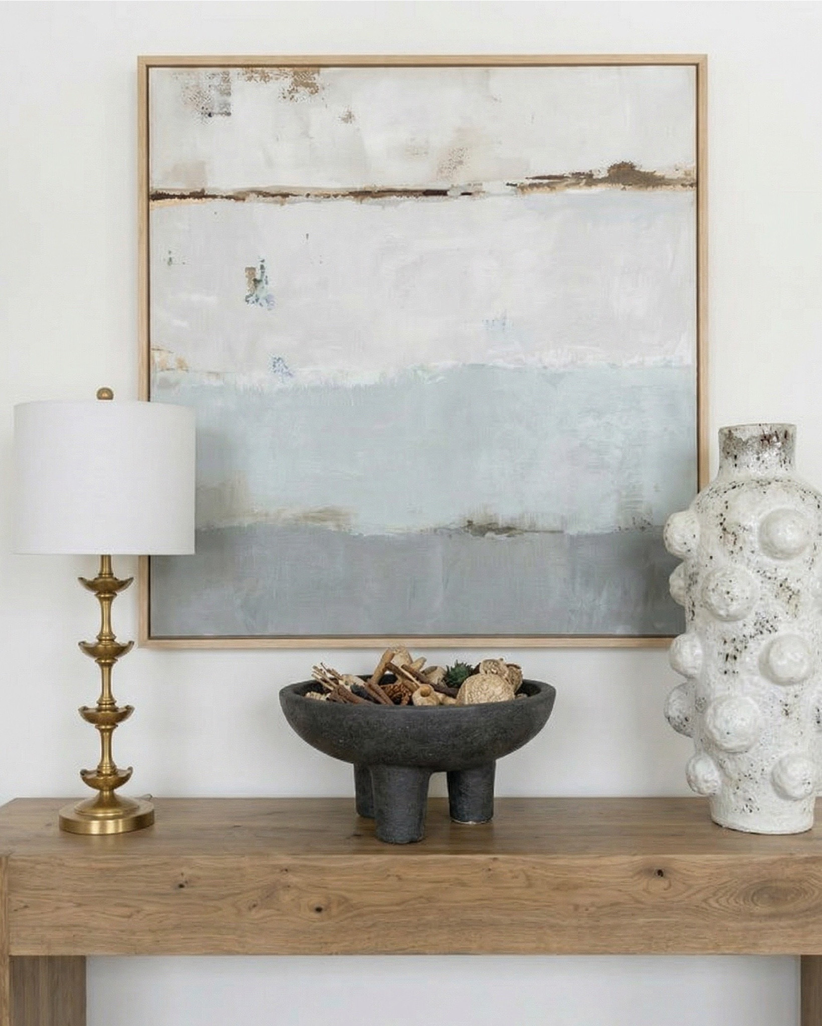 Shop the look: 
* Wood Dining Table
* Black upholstered dining  Chairs 
* Wood console table
* Brass table lamp 
* White ceramic vase
* Brass candle holders
* Blue wall art
* Neutral modern wall art
* Brass wall sconce 
* Wood cabinets 
* Blue traditional pattern rug
* Blue wall paper
* Tall ceramic vase
* Black decor bowl

#LTKhome #LTKsale #LTKstyletip
