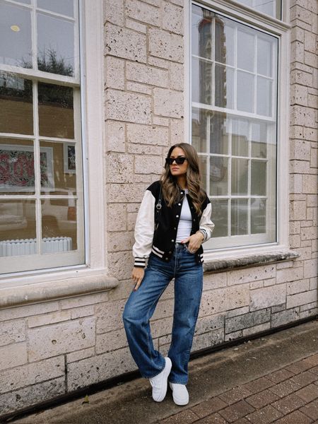Cute + casual spring outfit. I love this varsity jacket! It's under $100 & great for spring. I'm wearing a size S in the tee & jacket & 25 in the jeans. Sized up half a size in the sneakers. // spring outfit, spring wardrobe, spring outfit ideas, jeans outfit
