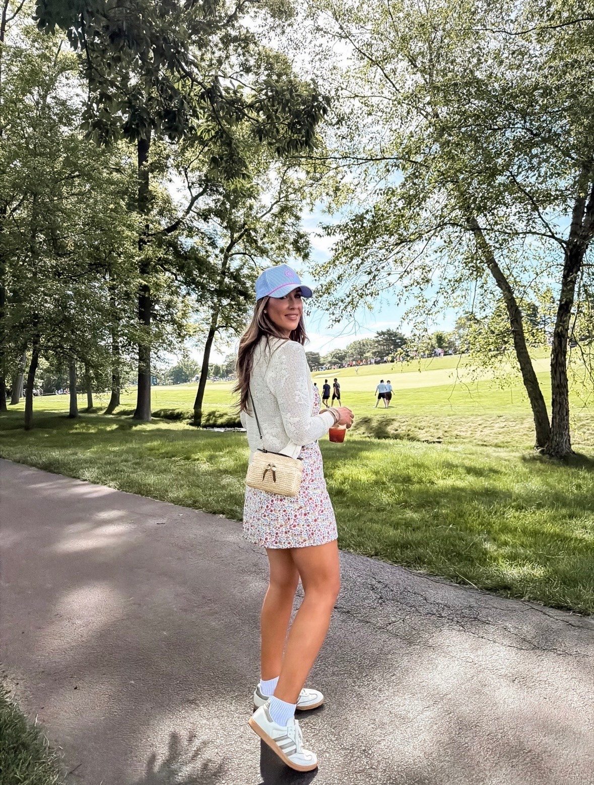 Such a cute outfit for a day at the course. The floral dress, lightweight cardigan, and sneakers are the perfect mix of comfortable and polished, and that woven crossbody ties everything together. One of those outfits that works from morning coffee to walking the course.

golf tournament outfit, floral mini dress, casual summer outfit, golf spectator style, lightweight cardigan, woven crossbody bag, comfortable sneakers, summer dress outfit, country club style, everyday fashion, weekend outfit inspiration, feminine style, vacation outfit, themominstyle

#LTKootd #LTKTravel #LTKSeasonal