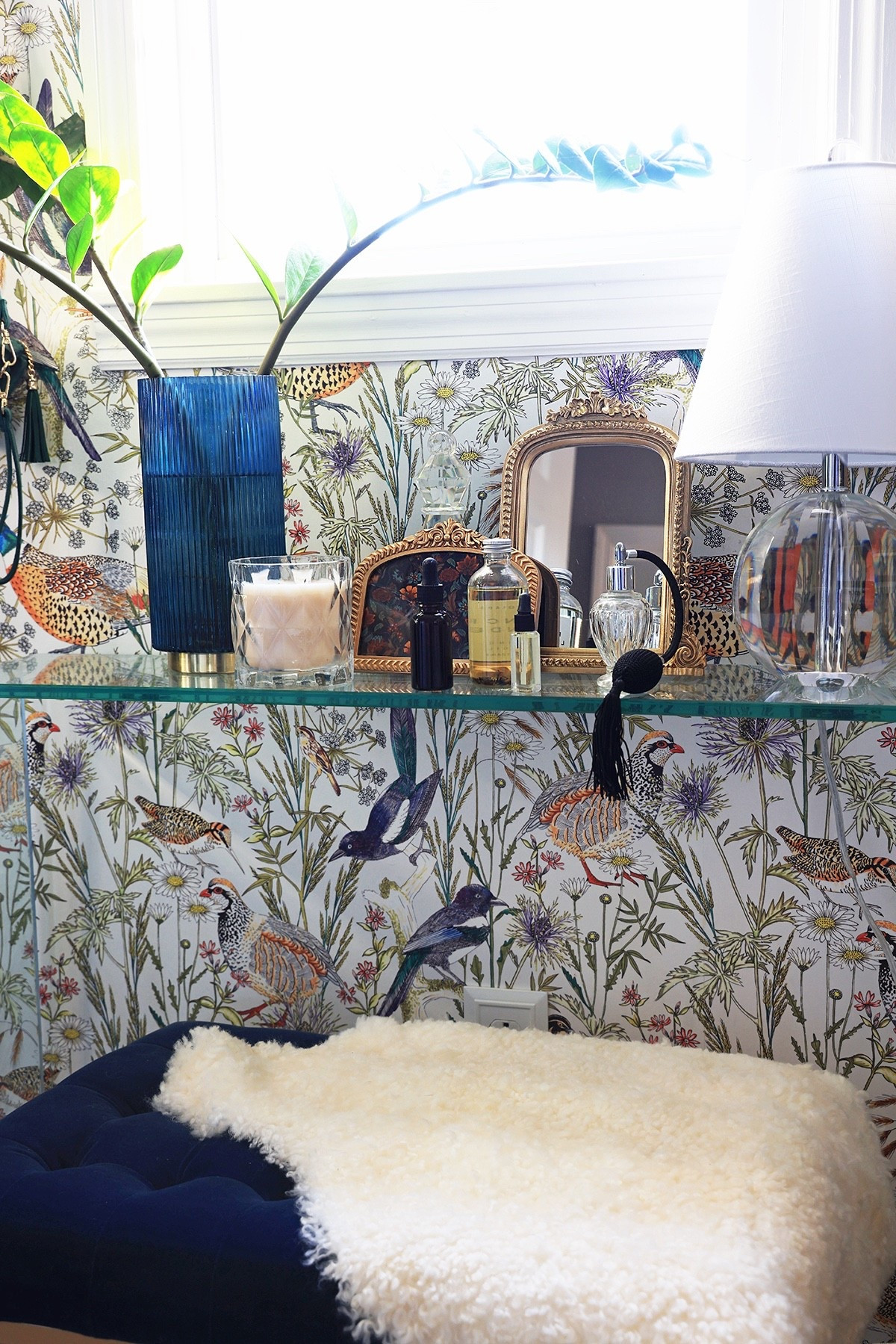 Dressing room vignette |  Small mirror, gold frames, vintage perfume bottles, small lamp, and vase for stems 

#LTKHome