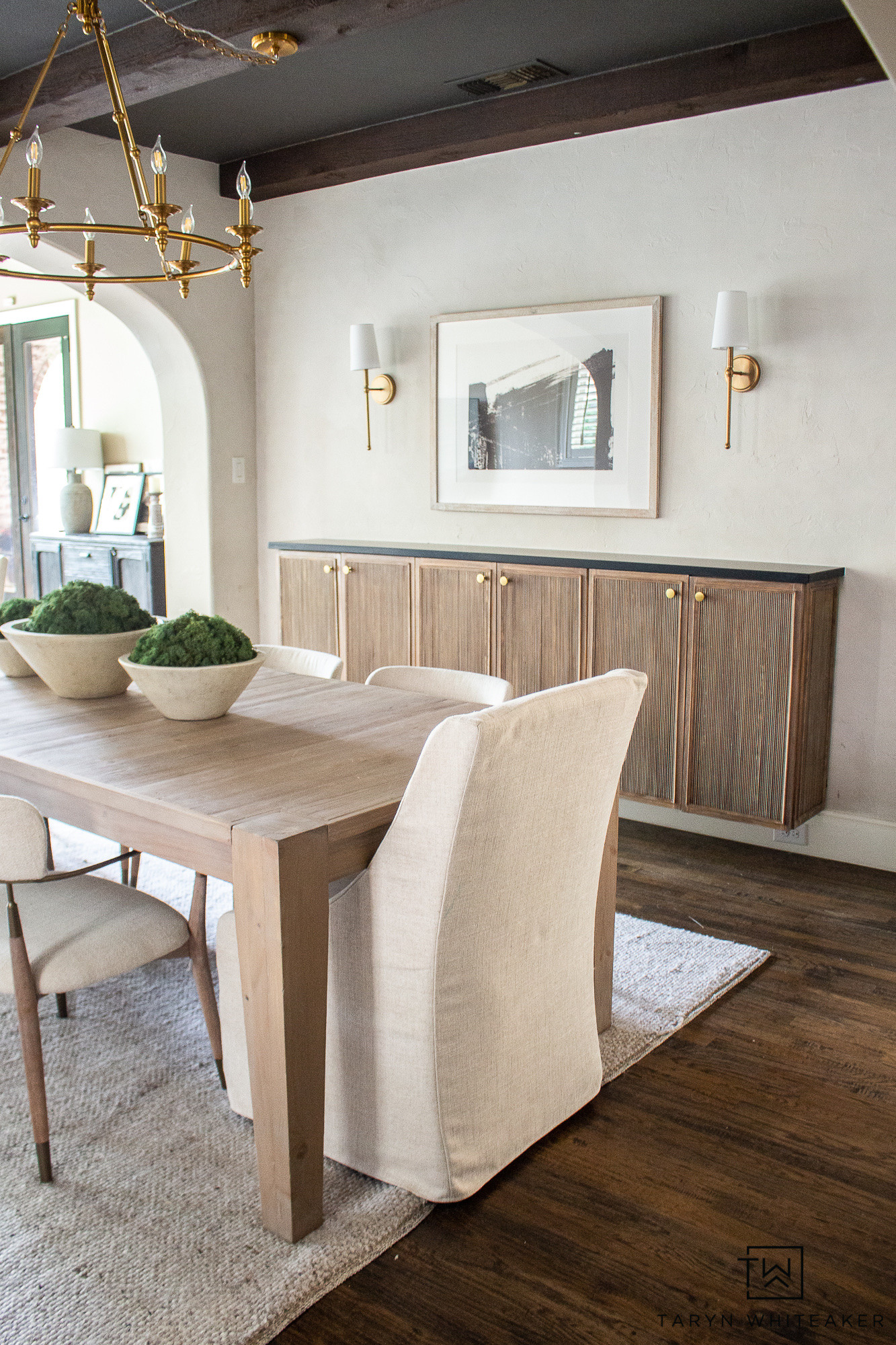  dining space that feels timeless and inviting. Neutral tones, warm wood, and classic lighting come together to create a room that works just as well for everyday meals as it does for hosting.

#LTKHome #LTKdayinmylife #LTKSeasonal