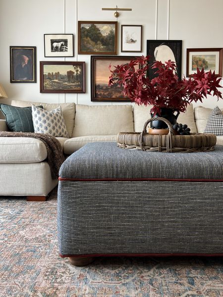 Striped fabric, pillows, faux fall stems, red branches, wicker tray, sectional. Loloi rug 

#LTKhome