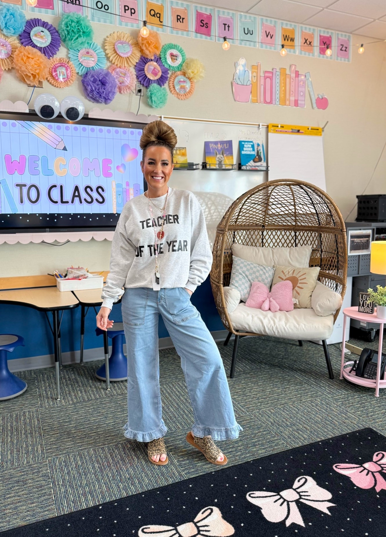 Super comfy and cute teacher ootd today! Ruffle jeans, oversized teacher of the year sweatshirt, big Dornfeld bun (as my students call it) and my leopard sandals from Blowfish. 💗🍎🐆

#LTKootd #LTKOver40 #LTKWorkwear