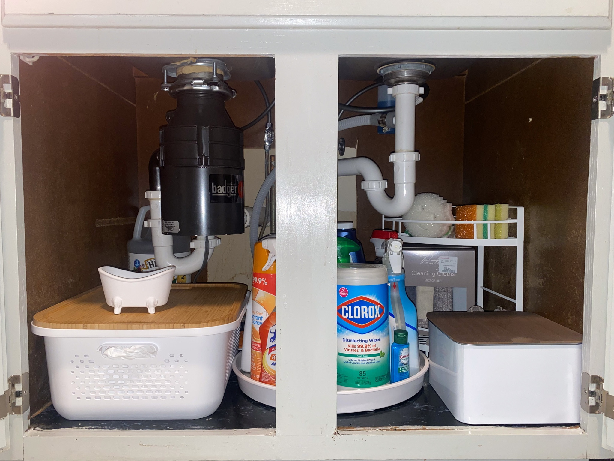 Under kitchen sink organization items that just make sense! White bucket holds 2 Costco sized trash bags!!! In the brown top container on the right is filled with dishwasher pods (Found in the $5 and under section in target)! The giant lazy Susan is perfect for all cleaning products! 

#LTKhome #LTKstyletip #LTKfamily