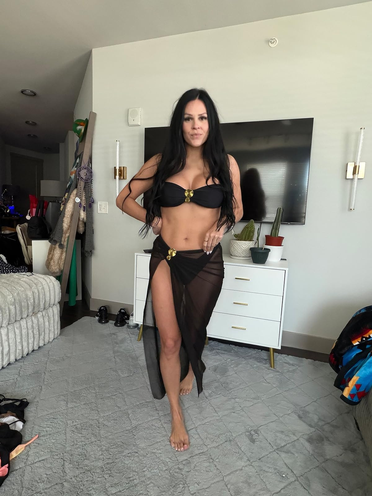 Classic chic. This sleek black bikini set is elevated with gold hardware accents and a matching sheer mesh sarong for the ultimate poolside statement. #BlackBikini #BeachCoverup #LTKswim 

 #LTKSpringSale #LTKdayinmylife #LTKootd