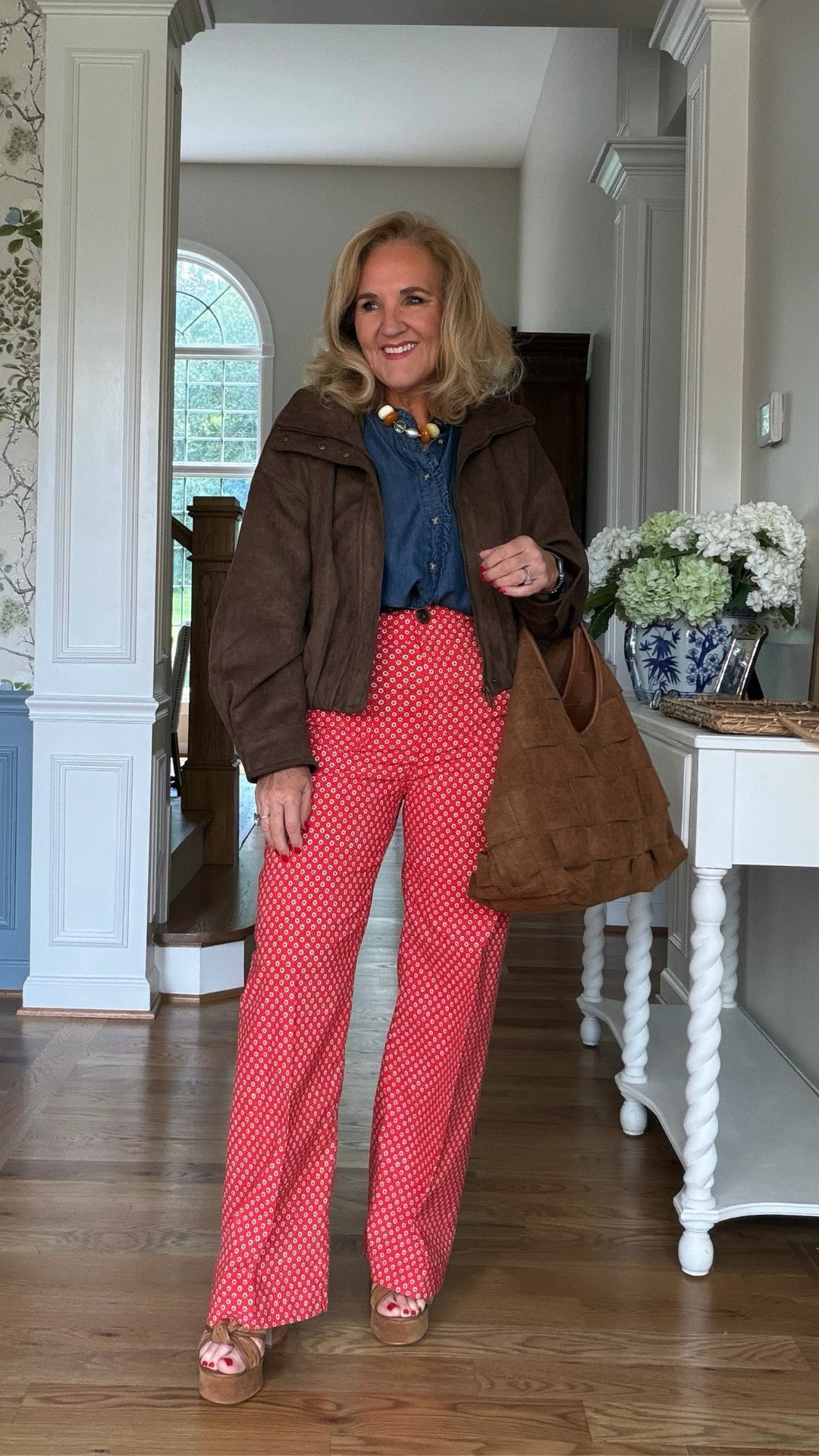 This brown suede-style jacket and red printed pants make such a fun fall combination. The denim shirt keeps it casual, while the rich brown accessories pull everything together.

💡 LTK MADE EASY
❤️ Heart = Support my posts!
🔖 Save = Get sale & restock alerts
📋 Lists = Keep favorites organized
📲 Share = Send lists and products to a friend. Hello, Christmas List!
💬 Comment = Ask me anything about what I'm wearing.:-)

#LTKootd #LTKTravel #LTKOver40