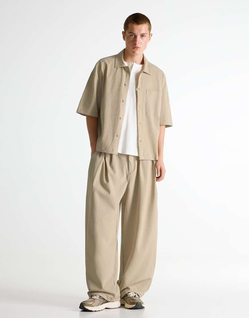 Bershka Pleated semi-jogger super baggy trousers in beige-Neutral | ASOS (Global)