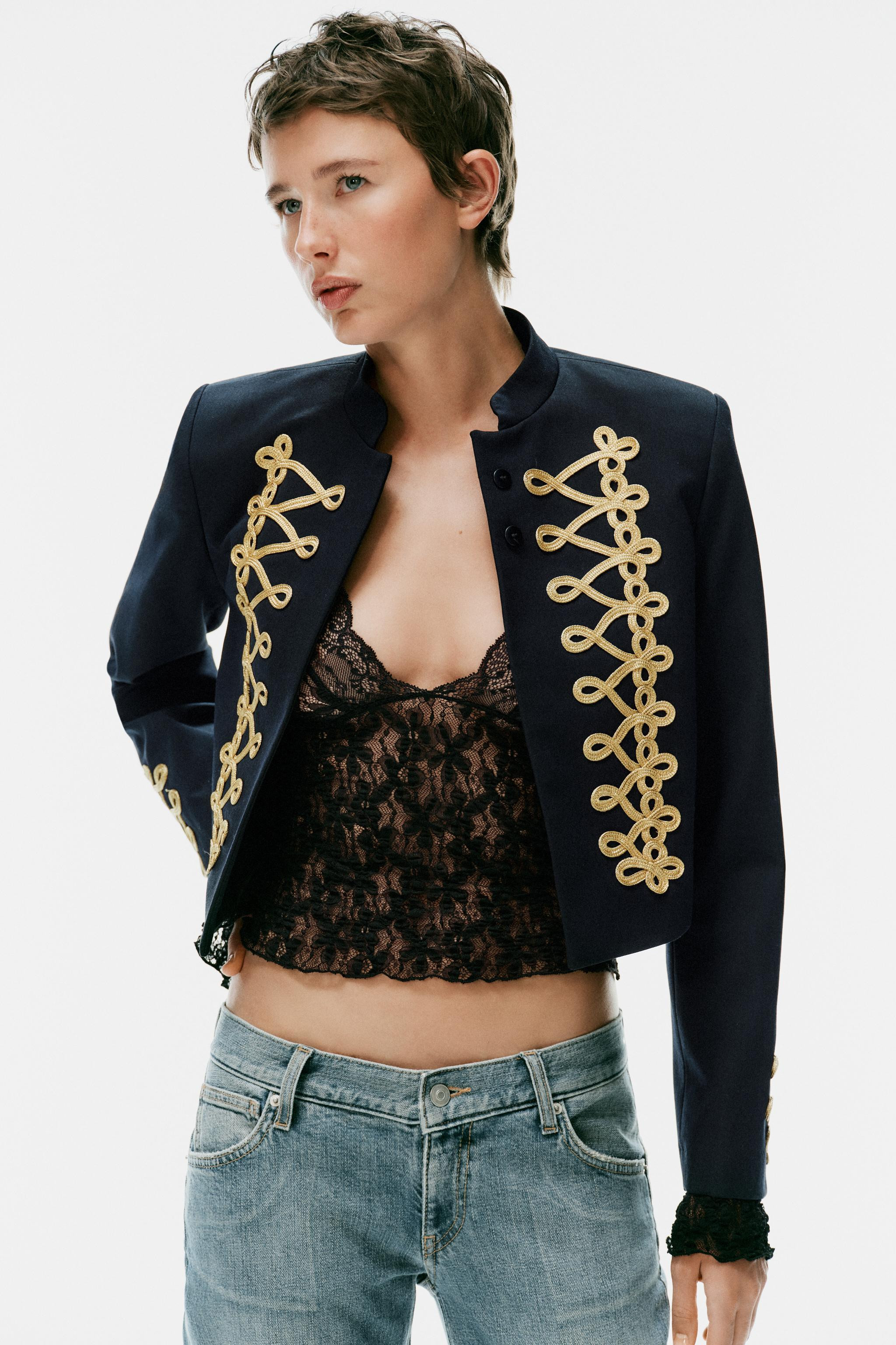 Cropped blazer with a stand-up collar and long sleeves. Features contrasting frog fastening detai... | Zara US