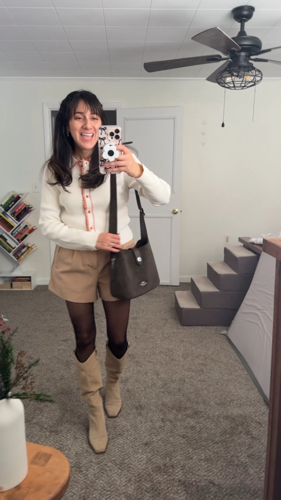 Sharing this outfit for winter and early spring 💕 worn with boots and stockings. I have such a crush on this brown suede bag by Coach 

Button cardigan: size L
shorts: size 10
Boots: size 8 1/2 