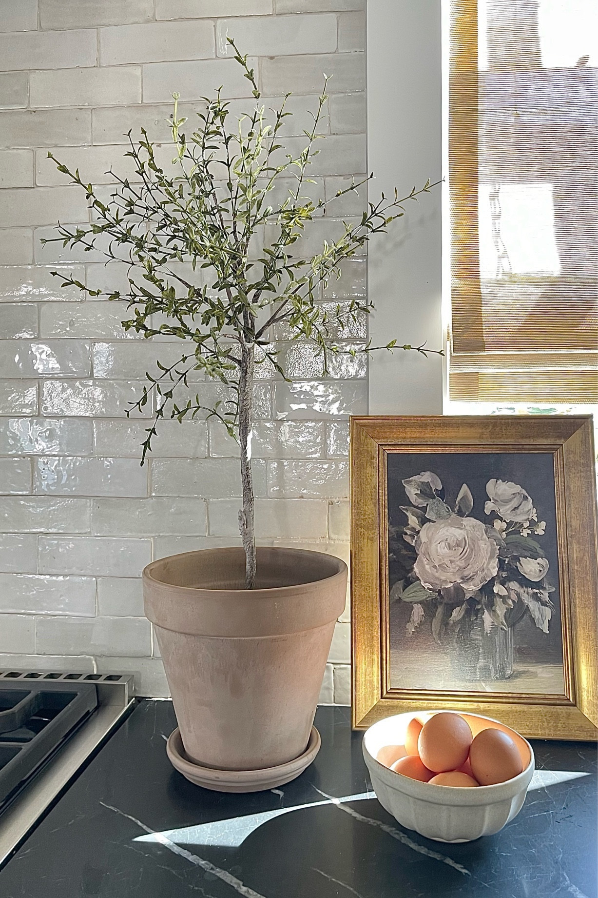 Love love love this faux topiary olive tree in our kitchen!

Vintage inspired art, terra cotta pot, Zellige tile 

#LTKhome