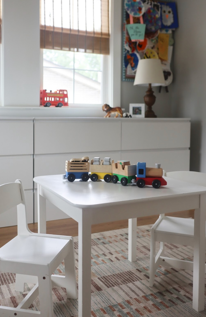 This vintage-inspired boys’ playroom is proof that functional spaces can still feel timeless and beautiful.✨ What started as a simple update turned into one of the most-loved rooms in our home. We created a space that blends organization, creativity, and charm — complete with a dedicated art table, a bulletin board for their masterpieces, and plenty of thoughtful storage. The soft white and cream palette, paired with pops of muted color and vintage-inspired details, keeps the room feeling warm, cohesive, and full of personality. It’s a playful, practical space designed to grow with our boys — and a perfect reminder that family spaces can be both stylish and full of joy.🎨🤍 

 #playroomdesign #vintagestyle #familyhome #LTKHome #LTKFamily
