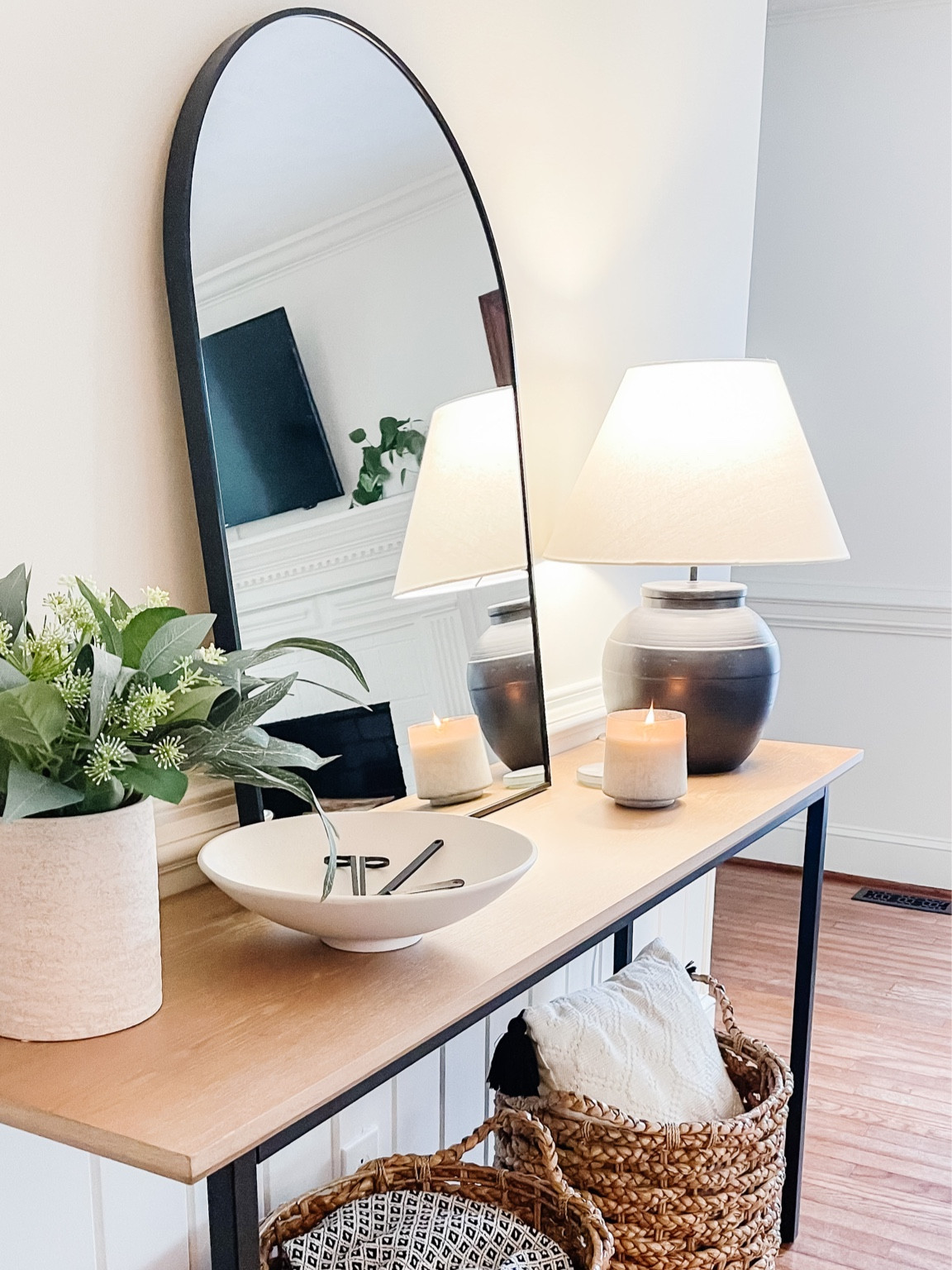 Beautiful entryway decor. Chunky lamp. Beautiful storage baskets. Arched Mirror. 

#LTKunder50 #LTKhome #LTKsalealert