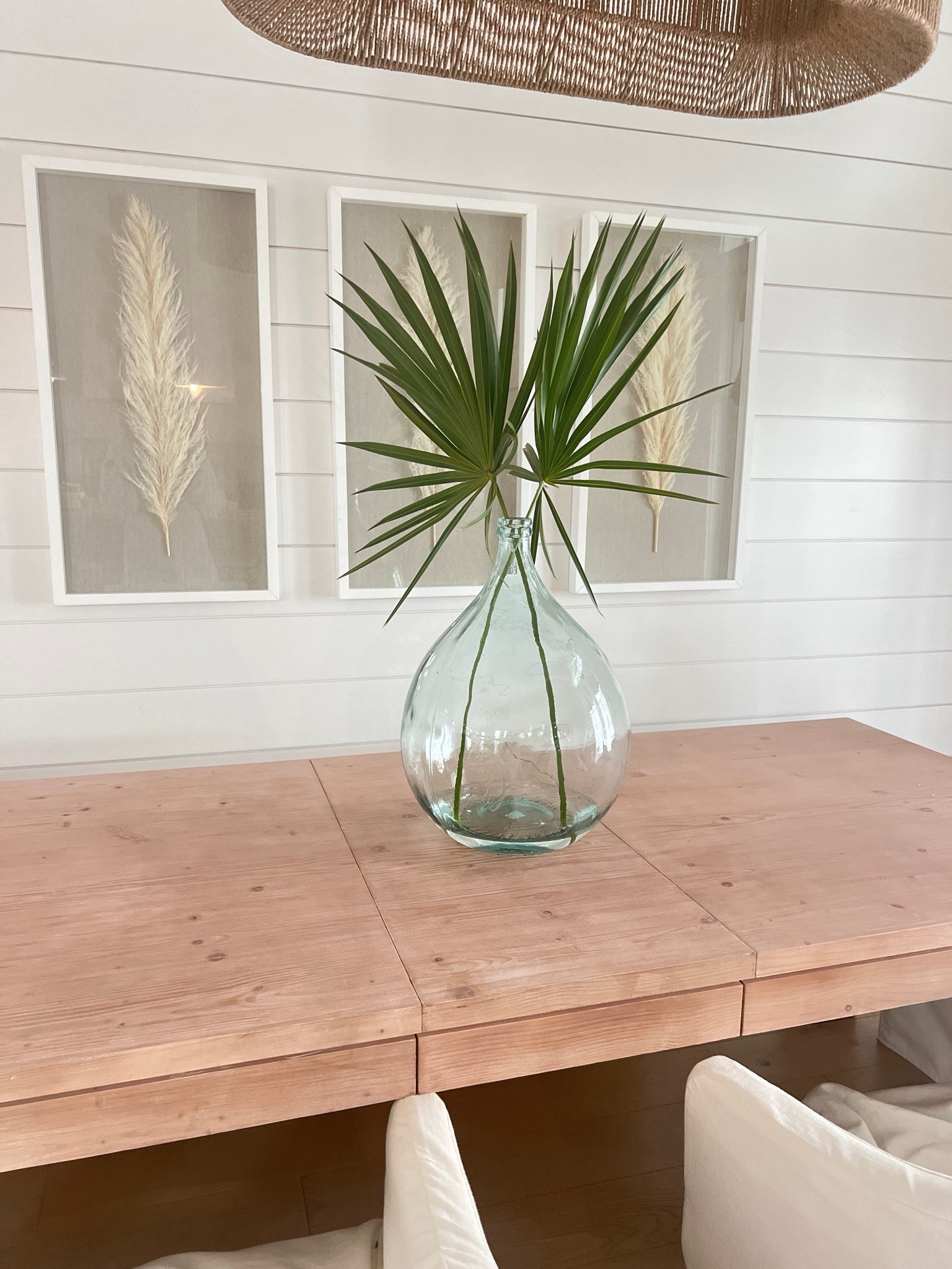 Dining room table. I love this oversized vase and pampas grass wall decor.  

#LTKHome #LTKStyleTip