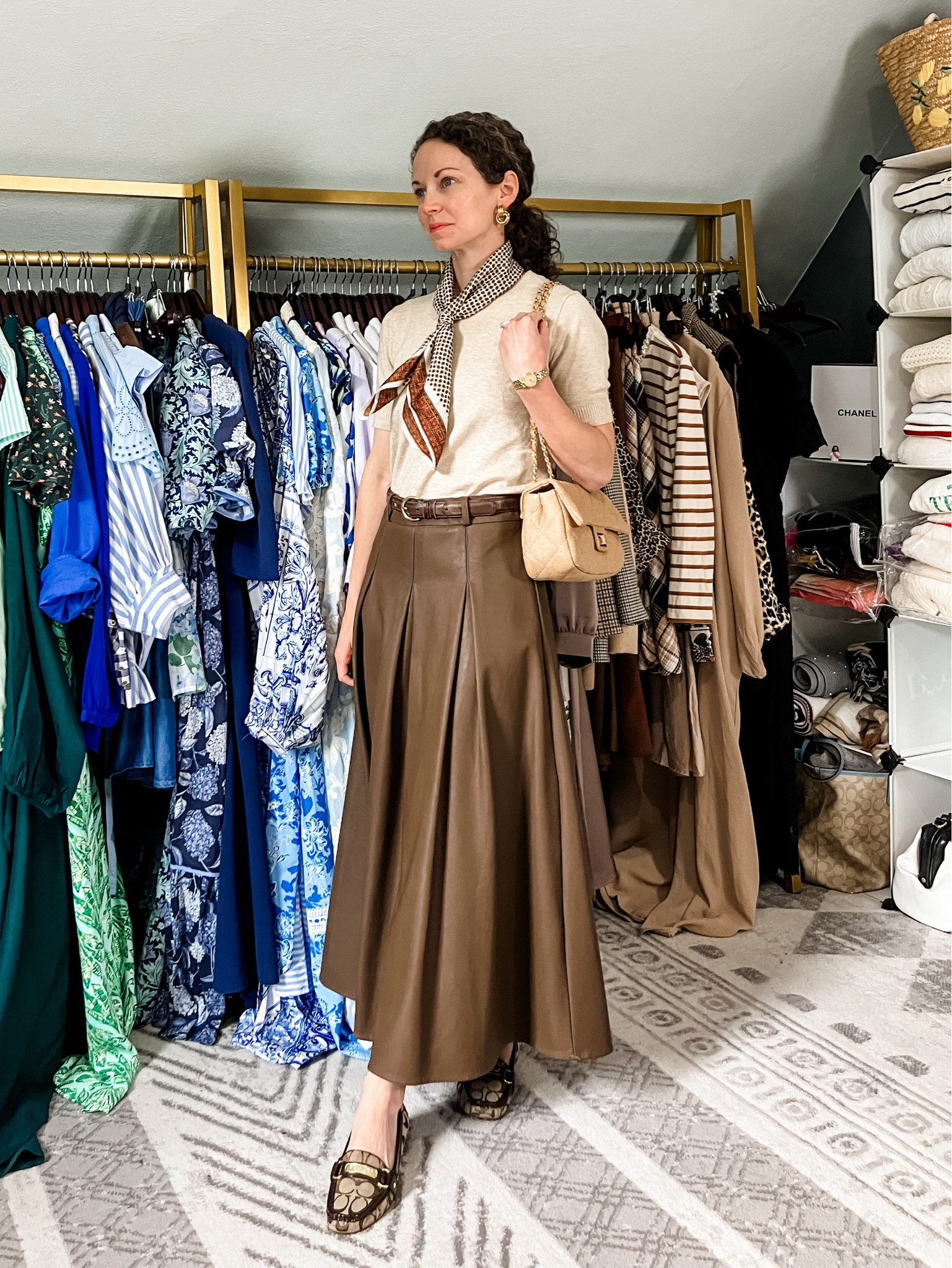 A spring outfit to match my coffee order!
Beige sweater top is old from J.Crew, linking similar. 
Brown faux leather skirt from Chicwish. 
Gold door knocker earrings are from a local boutique, linking similar. 
Brown silk scarf is vintage, linking similar. 
Gold watch is vintage Gucci, linking similar  
Brown leather belt is vintage Coach, linking similar. 
Quilted handbag from Urban Expressions. 
Loafers are old from Coach, linking similar. 
Fragrance is Sunlit Santal. 
Petite outfit. Modest outfit. Classic outfit. Spring outfit. Neutral outfit  

#LTKootd #LTKmomlife #LTKgrwm