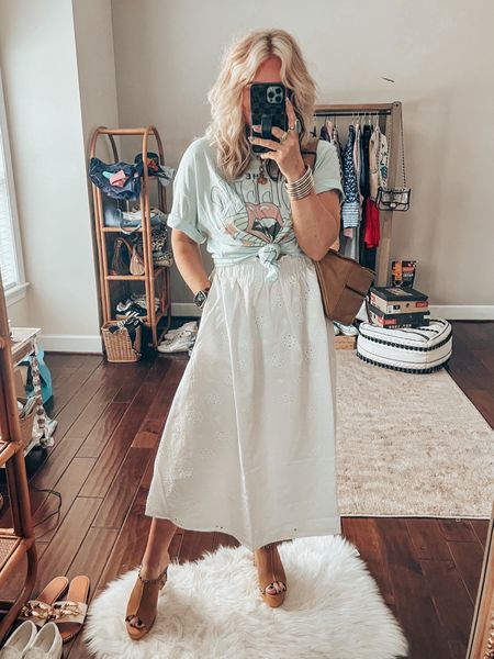 Graphic tee & maxi eyelet skirt style 
Necklace save with code MANDIE15
Tee size m 
Skirt size m 
Sandals true to size 
Dingo sandals, crossbody bag, white skirt, spring style, band tee 

#LTKSeasonal #LTKstyletip #LTKover40
