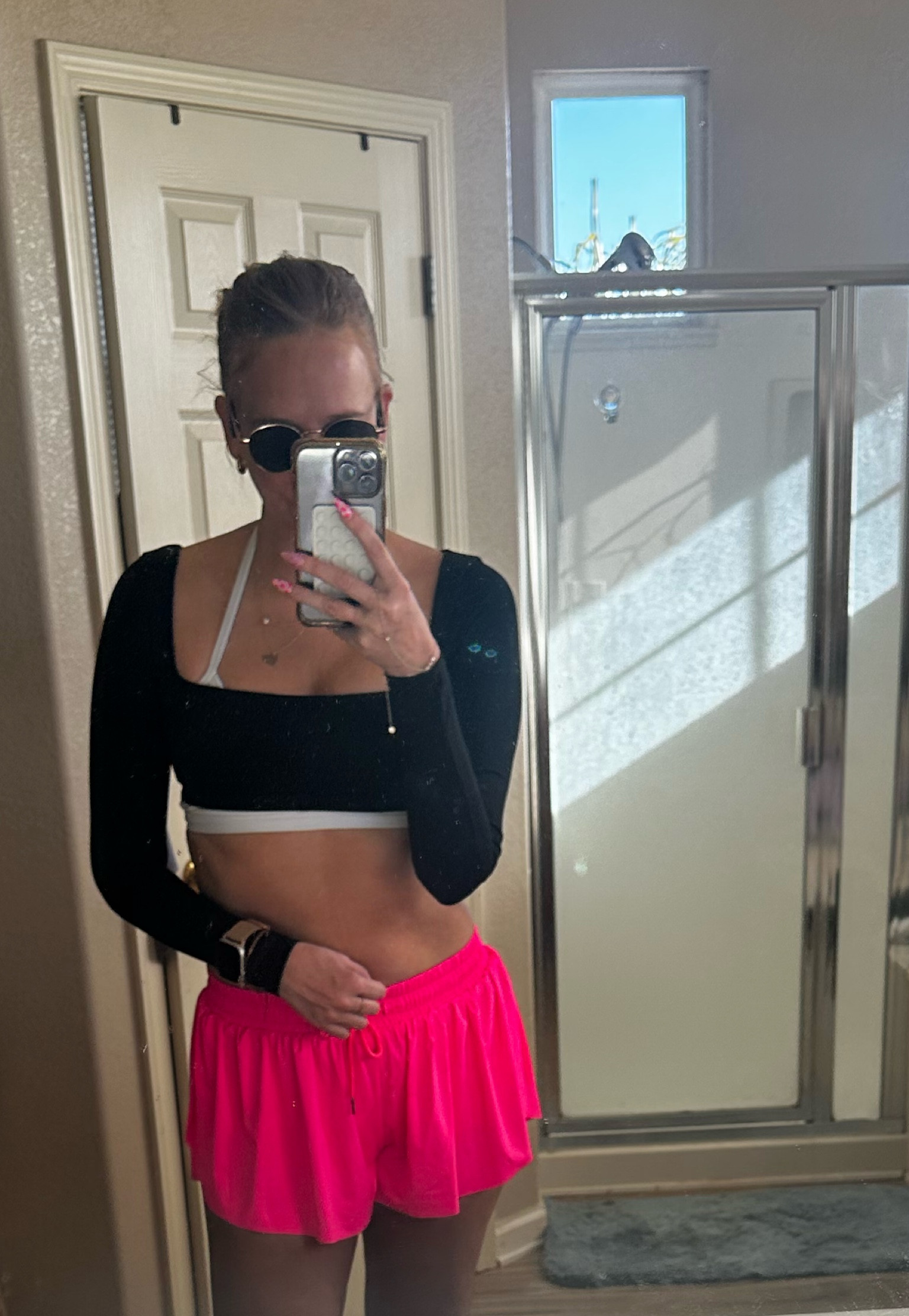 Runner fit 
Black long sleeve crop top 
Black/white sports bra 
Pink flowy butterfly 2 in 1 runner shorts with pockets 
Hoka Mach 6 running shoes 

#LTKMostLoved #LTKActive #LTKFitness