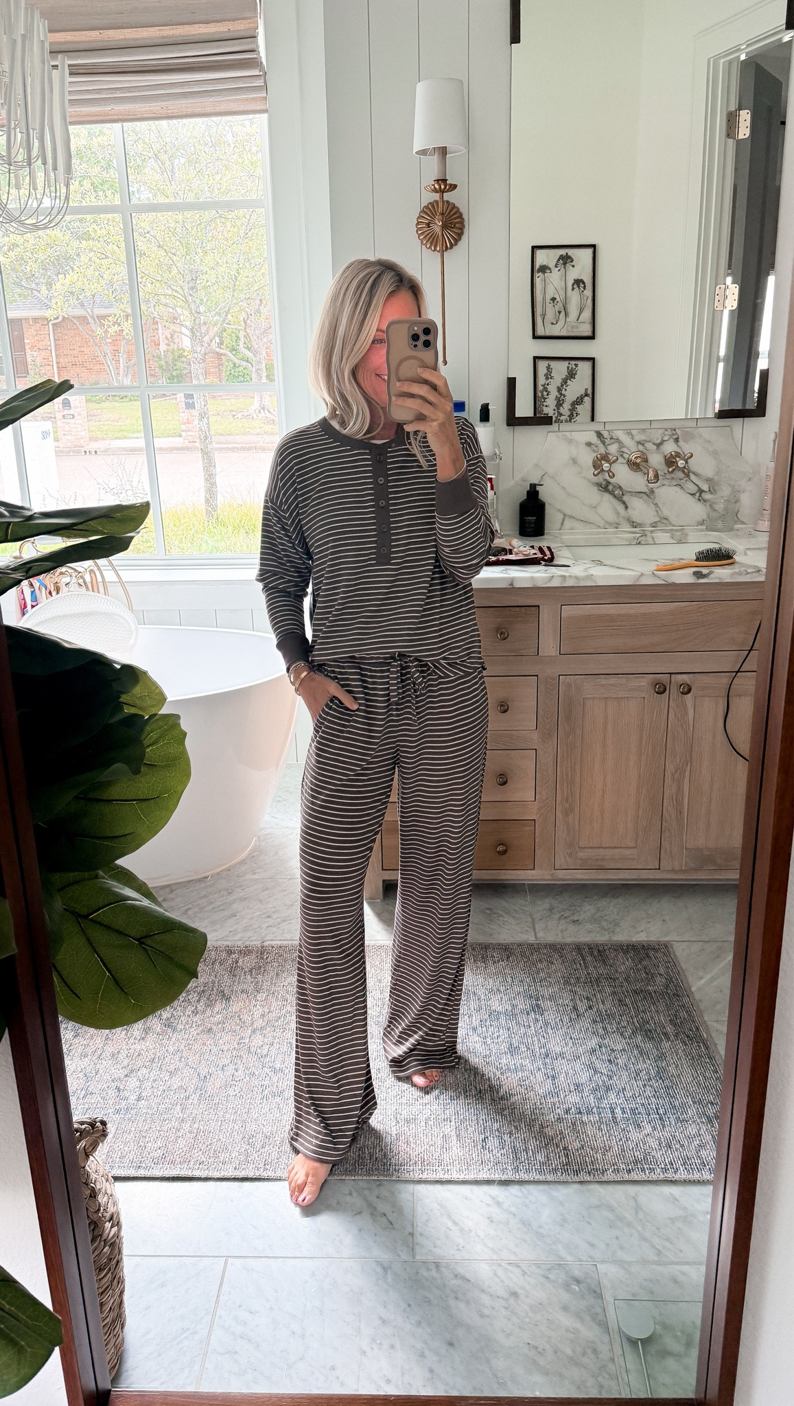Nothing is screaming fall more than these striped chocolate pjs! Absolutely obsessed with the quality, feel, and price of these pjs finds .

Pj: small
