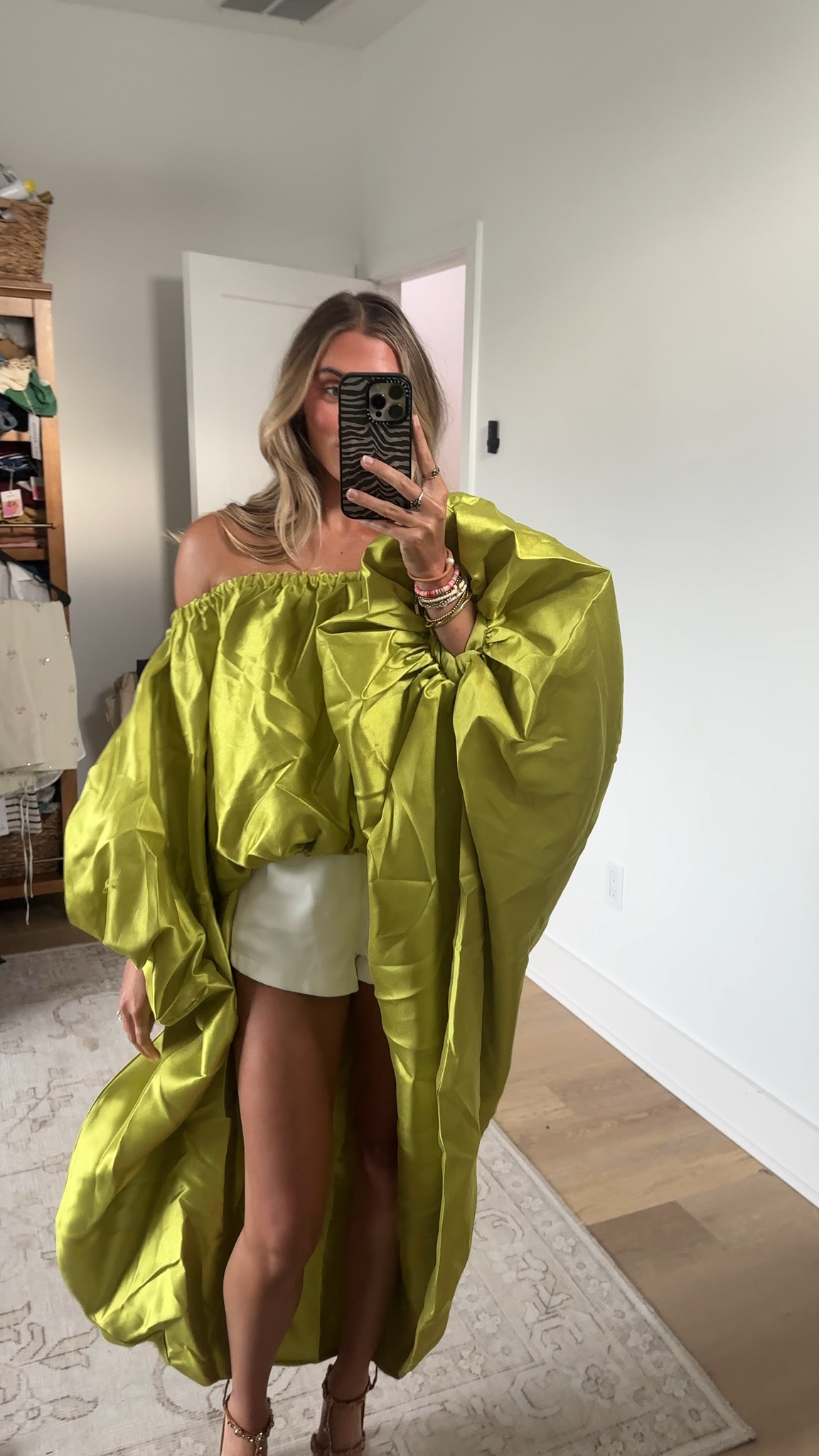 @shopakira size small medium Extravagant high low blouse designed for special occasions, formal wear, and statement styling. Featuring a rich chartreuse fabrication with a rich metallic sheen, elasticized off-the-shoulder neckline, long puff sleeves, and ultra-voluminous bubble silhouette that cascades outwards at the hips. Complete with a striking high-low hemline that rises in the front and falls into a dramatic sweeping back overlay. Style with the coordinating AKIRA Label By My Side Trouser In Chartreuse, statement earrings, and towering stiletto sandals for an editorial, avant-garde finish.

#LTKootd #LTKSeasonal #LTKdayinmylife