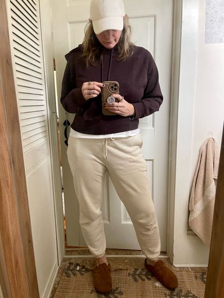 Cozy Fall outfit. 

Target brown hooded sweatshirt, corduroy baseball cap, Uniqlo sweatpants, loungewear, Birkenstock clogs

#LTKfindsunder50 #LTKstyletip #LTKover40