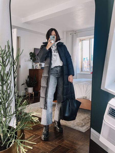 How to style a puffer coat for winter with washed black jeans. Anine Bing sweatshirt. Dr marten boots  

#LTKstyletip #LTKshoecrush #LTKfindsunder100