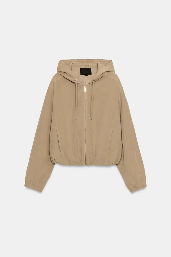 Bomber-style jacket featuring a collar with an adjustable drawstring hood, long sleeves with cuff... | Zara UK