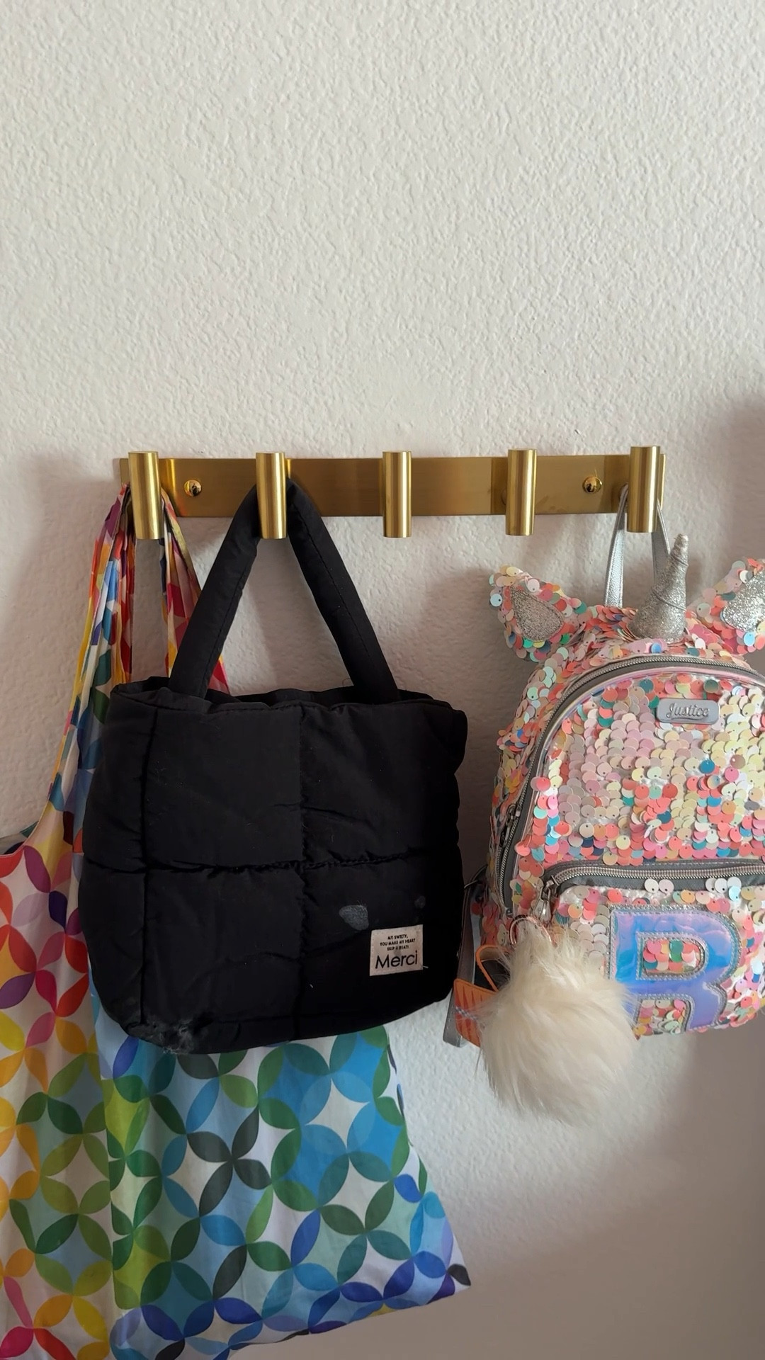 A simple wall-mounted hook rack is one of my favorite solutions for everyday organization. This style is perfect for backpacks, tote bags, jackets, purses, and accessories, keeping frequently used items off the floor and easy to grab. It’s a functional entryway, mudroom, and bedroom storage solution that adds organization without taking up valuable floor space.

#LTKKids #LTKHome