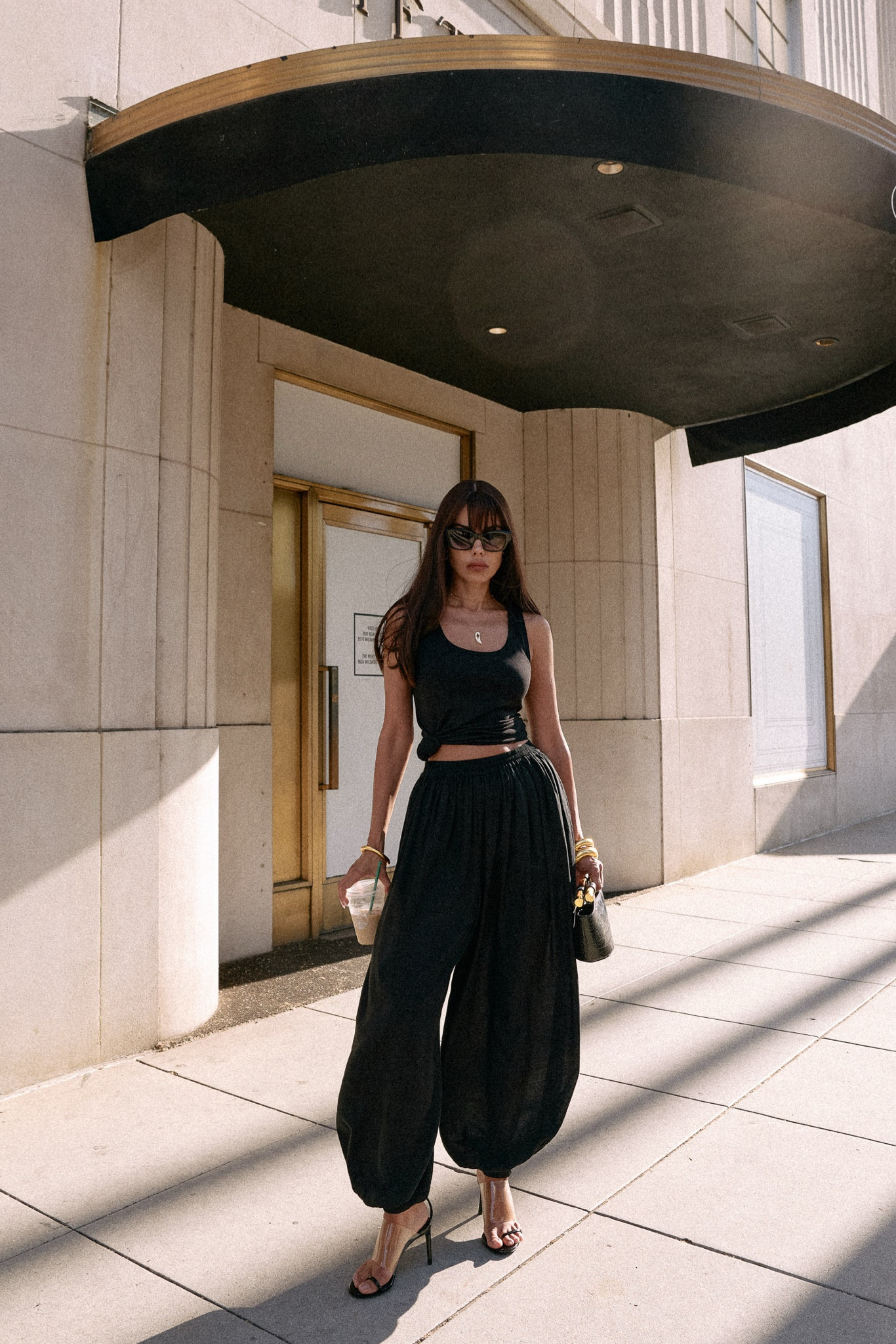 Why yes you can wear all black outfits during summer… 

Quick styling tip - add a few gold accents to make your all black look even more chic! ✨🖤 

Sizes: 
T shirt - small, pants - small, heels - 37 ( US 7) usually I’m 37.5 or 7.5 

#LTKItBag #LTKShoeCrush #LTKStyleTip