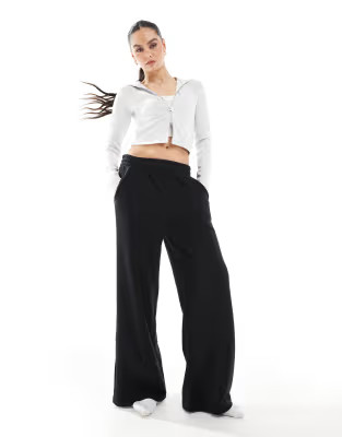Bershka wide leg joggers in black | ASOS (Global)