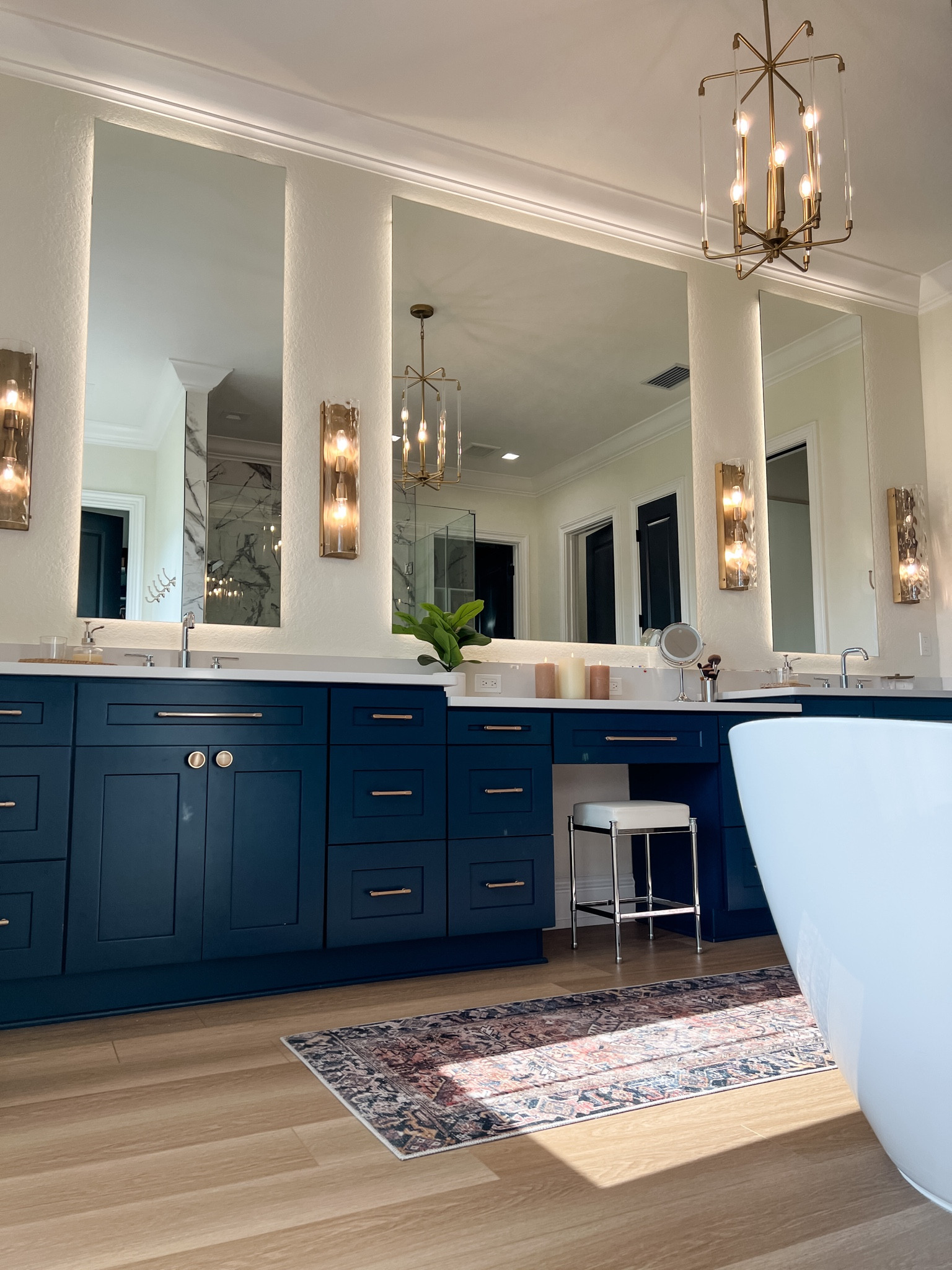 Primary bathroom views 

Bathroom vanity, bathroom chandelier, bathroom runner, bathroom sconce, bathroom stool

