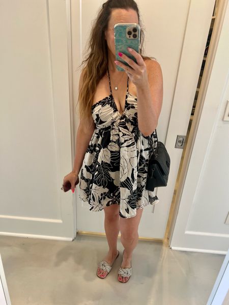 What I wore to Florida. Beach vacation outfit idea. This dress is so comfy, lightweight and airy. Even with 93% humidity and 96 degrees it’s melting level but I’m still feeling breezy and cute. @AE has lots of dresses on drop from $13-21 (Reg $50-60). What I wore on beach vacation| cute vacation dress | sexy vacation dress| resort dress| dress| beach outfit idea | sandals| coach crossbody bag | quilted bag| black bag| Florida vacation outfit | casual outfit idea | beach trip | beach vacay | family beach trip| family beach vacation | family beach vacay | Packing for a week beach trip | Packing for a weekend beach trip | what to pack for beach vacation woman | Packing for a beach weekend | packing for a beach vacation in a carry-on | Packing for a beach holiday| Steve Madden dupe sandals| sparkly sandals| rhinestone sandals| halter dress| mini dress| black white dress| dinner outfit| date nite outfit | brunch outfit | wedding guest dress| wedding guest outfit idea | summer dress| summer outfit idea| girls night out outfit  

#LTKunder50 #LTKFind #LTKstyletip