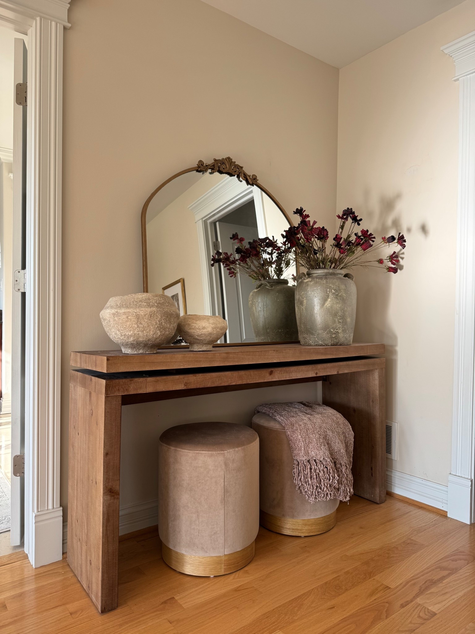 Console table styling inspo! I love the wood tone and texture of this designer inspired table. It’s great quality and incredible price. @wayfair #wayfairfinds #wayfair #wayfairpartner #consoletabledecor #consoletable #ottoman #vase #mirror 

#LTKHome #LTKStyleTip #LTKSaleAlert