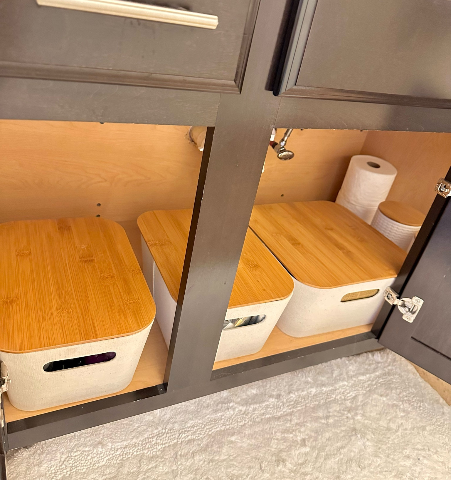 Cabinet storage solution! Loving the minimalist cream and bamboo color palette of these bins. The ceramic jars on the right are perfect for storing smaller bathroom items. 
#storage 
#minimalist 
#clean 
#organization 
#bins 
#bathroom

#LTKsalealert #LTKunder50 #LTKhome
