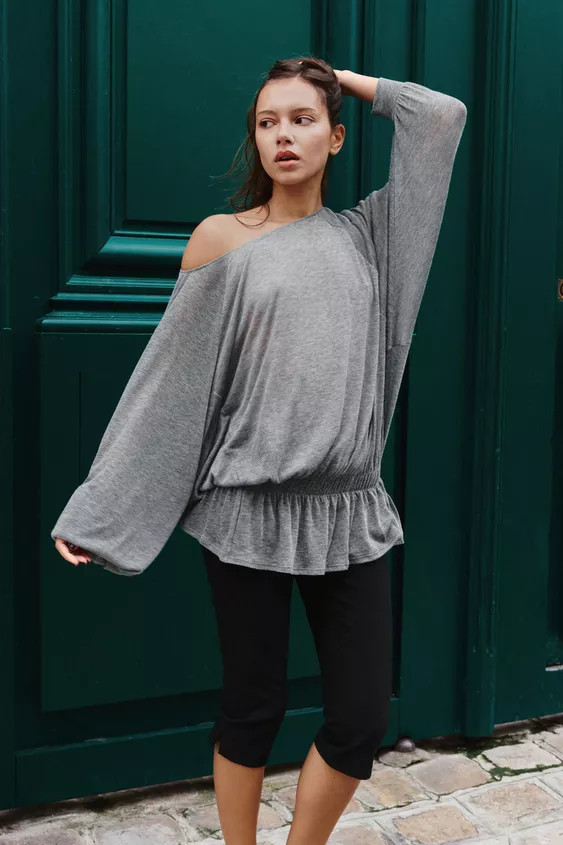 Boat neck top. Long batwing sleeves with cuffs. Elastic detail and ruffled hem. | Zara Canada