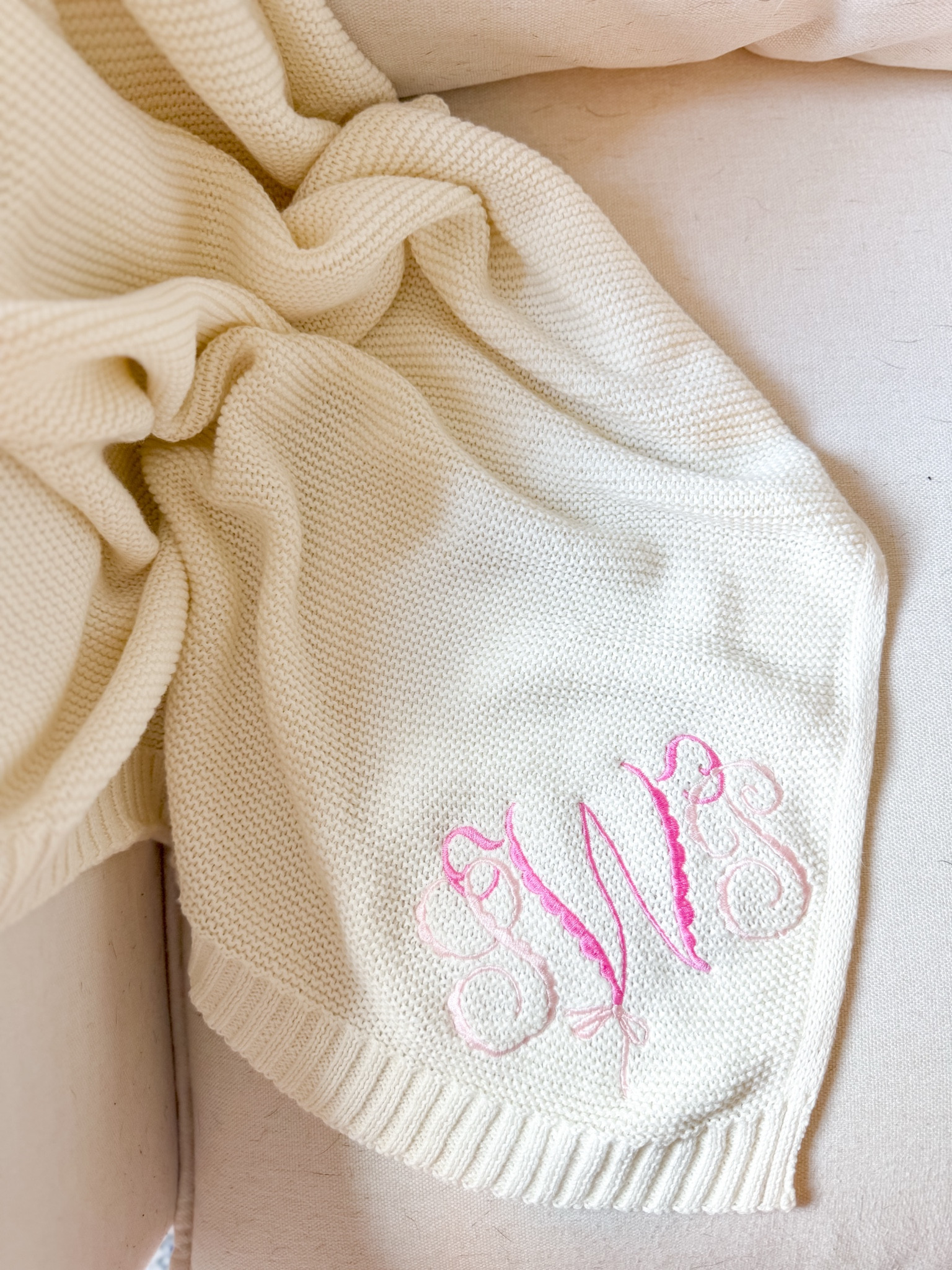 The sweetest scalloped bow monogram. 

I am always asked to use this on blankets, sweaters, or even a one lettered version on footies & gowns! 