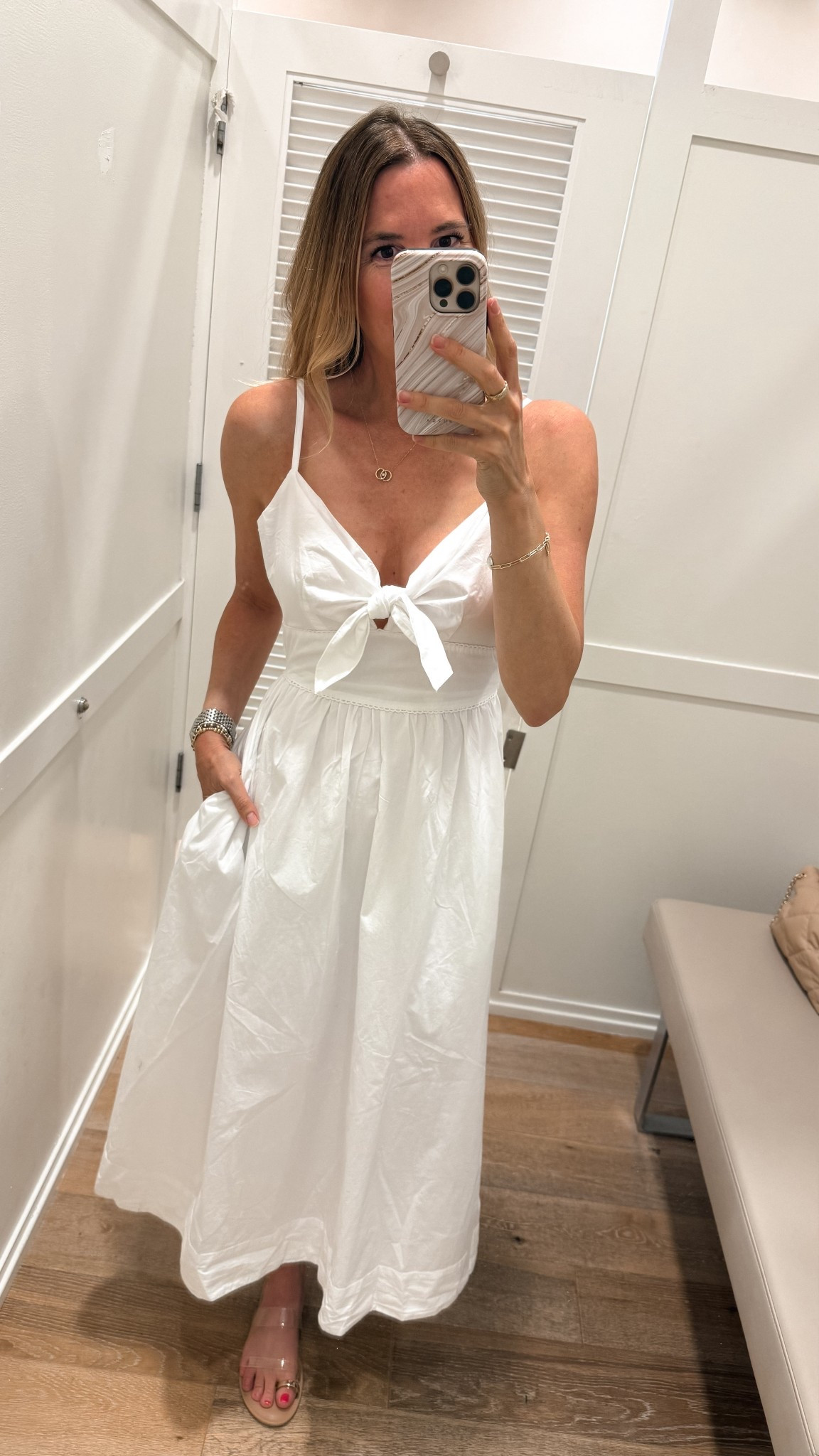 The perfect summer white sundress is now 50% off. Go down one size.