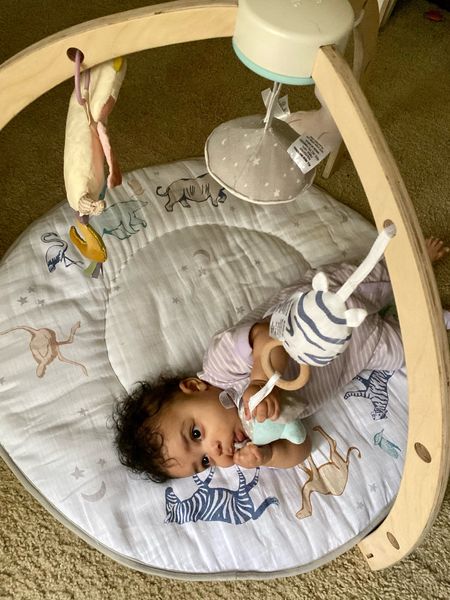 One of my favorite baby play mats, the Aden & Anias Play + Discovery Gym! I love how cute it is, and how soft the mat is! Safiya just loves playing with the toys, but it’s a win win for us!

#LTKFind #LTKbaby #LTKkids