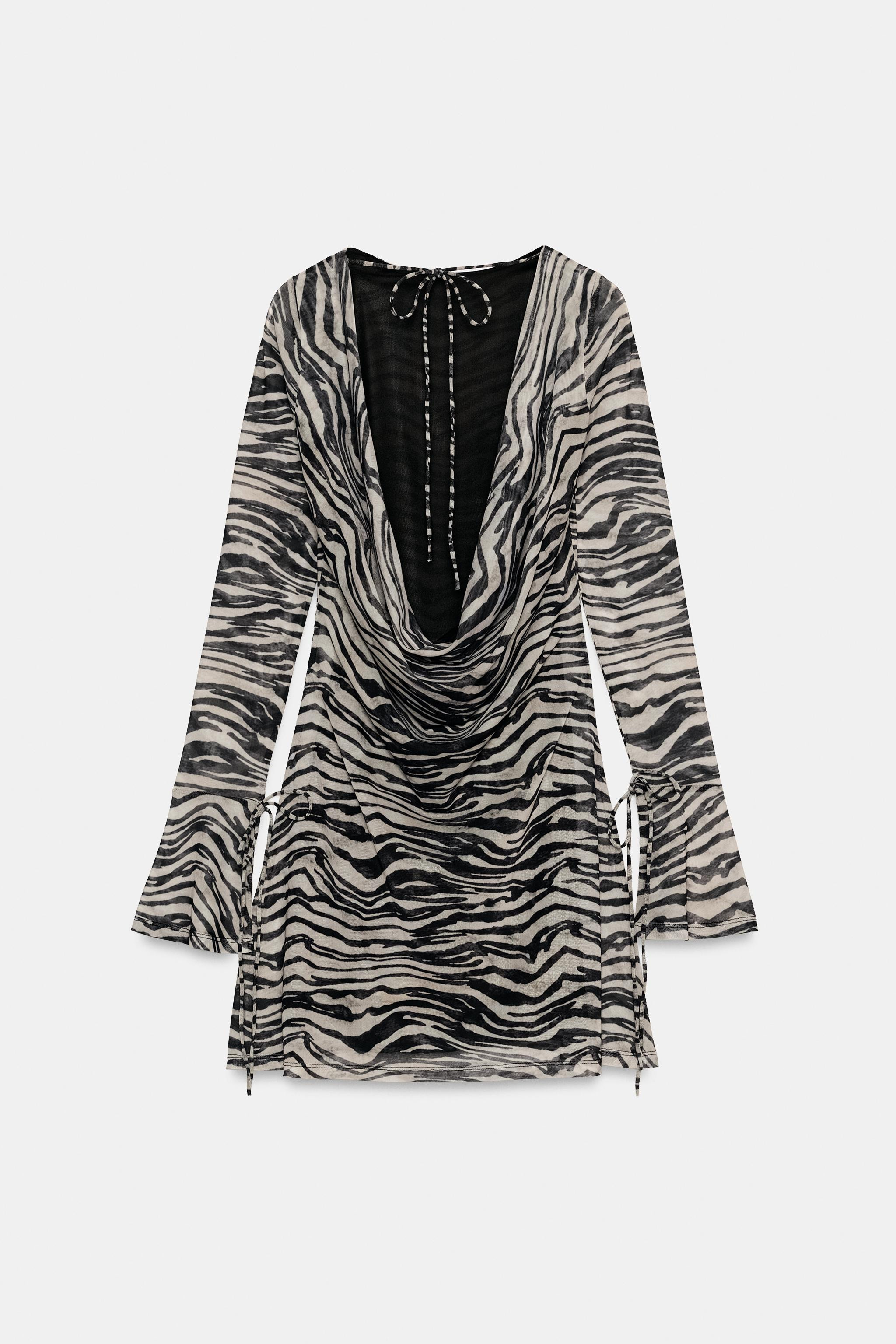 Boat neck dress featuring long bell sleeves with tie details. Open back detail with draped fabric... | Zara US