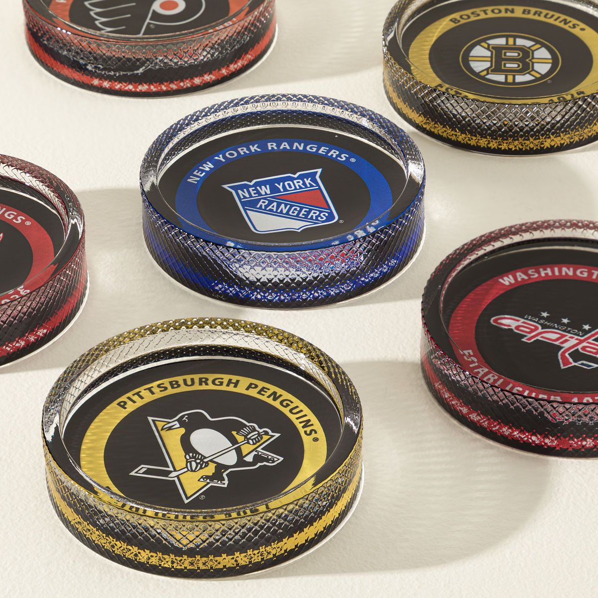 NHL Puck-Shaped Glass Coaster Set | UncommonGoods