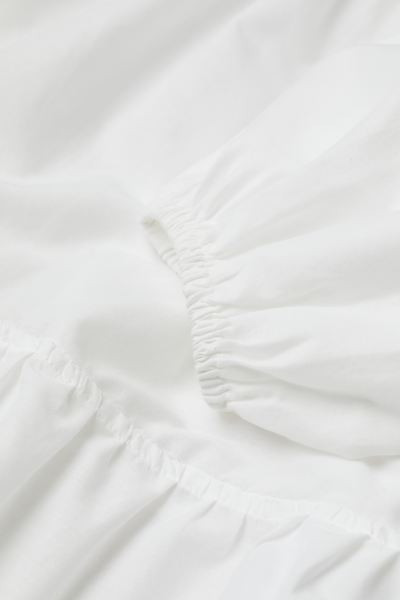 Short, flared beach dress in airy cotton poplin with a deep V-neck and gathered tiers to create w... | H&M (UK, MY, IN, SG, PH, TW, HK)
