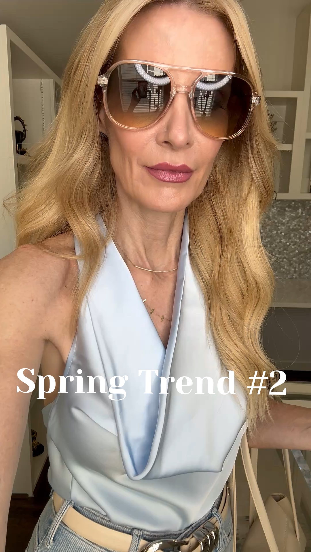 If you want a fresh update for spring, try incorporating ICE BLUE into your wardrobe. This vibrant satin halter instantly brightens the complexion, and paired with wide-leg denim, it creates that long, flattering line we all love. Chic, slimming, and so easy to wear. I’m in XS up top and 24 in jeans — everything runs true to size.  

 #LTKootd #LTKSeasonal #LTKOver40